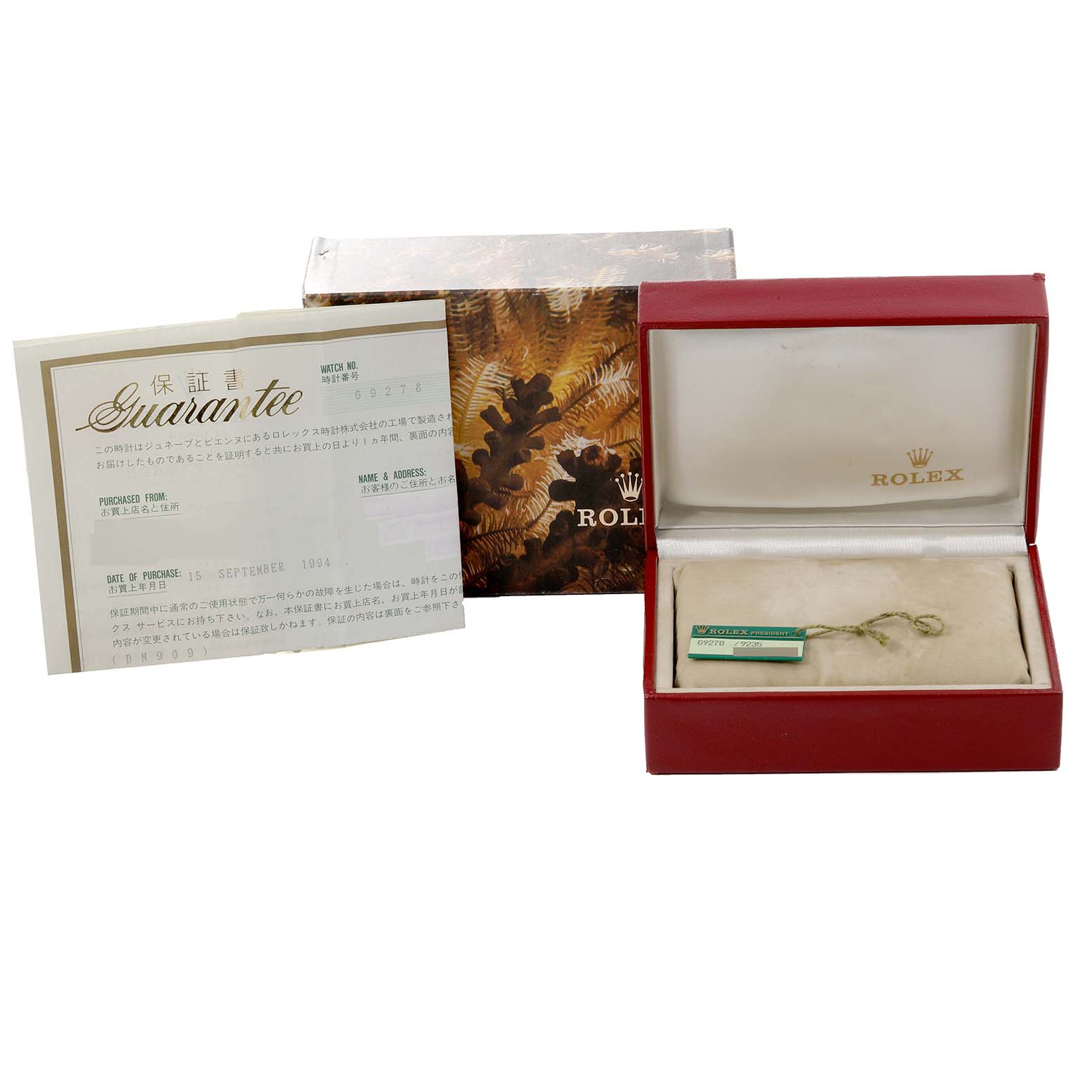 The image features the packaging and guarantee certificate for a Rolex Datejust 69278 Women's Yellow Gold Black Dial 69278 Women's Yellow Gold Black Dial watch, as well as an empty watch box.