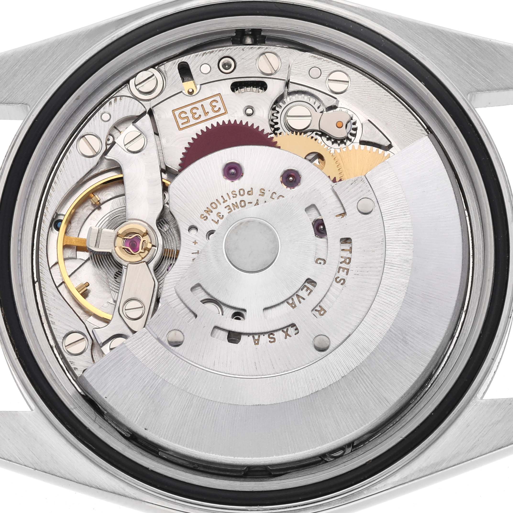 The image shows the movement of a Rolex Datejust 16200 Men
s Stainless Steel Silver Dial 16200 Men
s Stainless Steel Silver Dial watch from a rear angle, highlighting gears and the rotor.