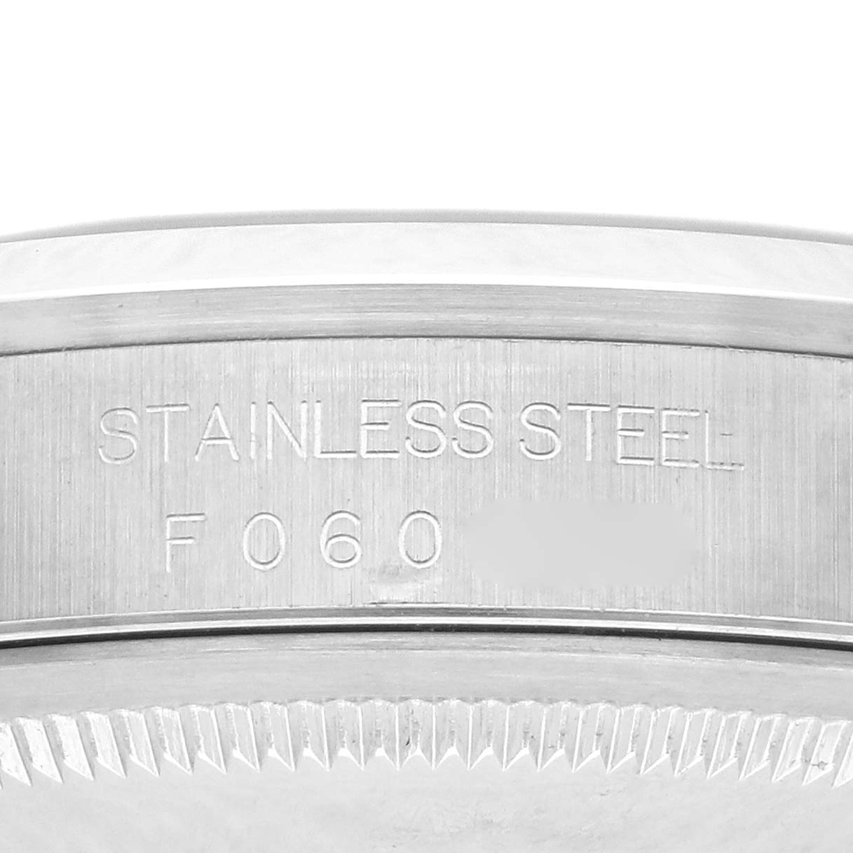 The image shows a close-up of the side of the Rolex Datejust 16200 Men
s Stainless Steel Silver Dial 16200 Men
s Stainless Steel Silver Dial casing, highlighting the "Stainless Steel" engraving.