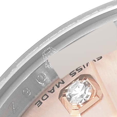 This close-up image shows part of the dial edge and a diamond hour marker of a Rolex Datejust 179171 Women's Steel and Gold (two tone) Pink Dial 179171 Women's Steel and Gold (two tone) Pink Dial watch.