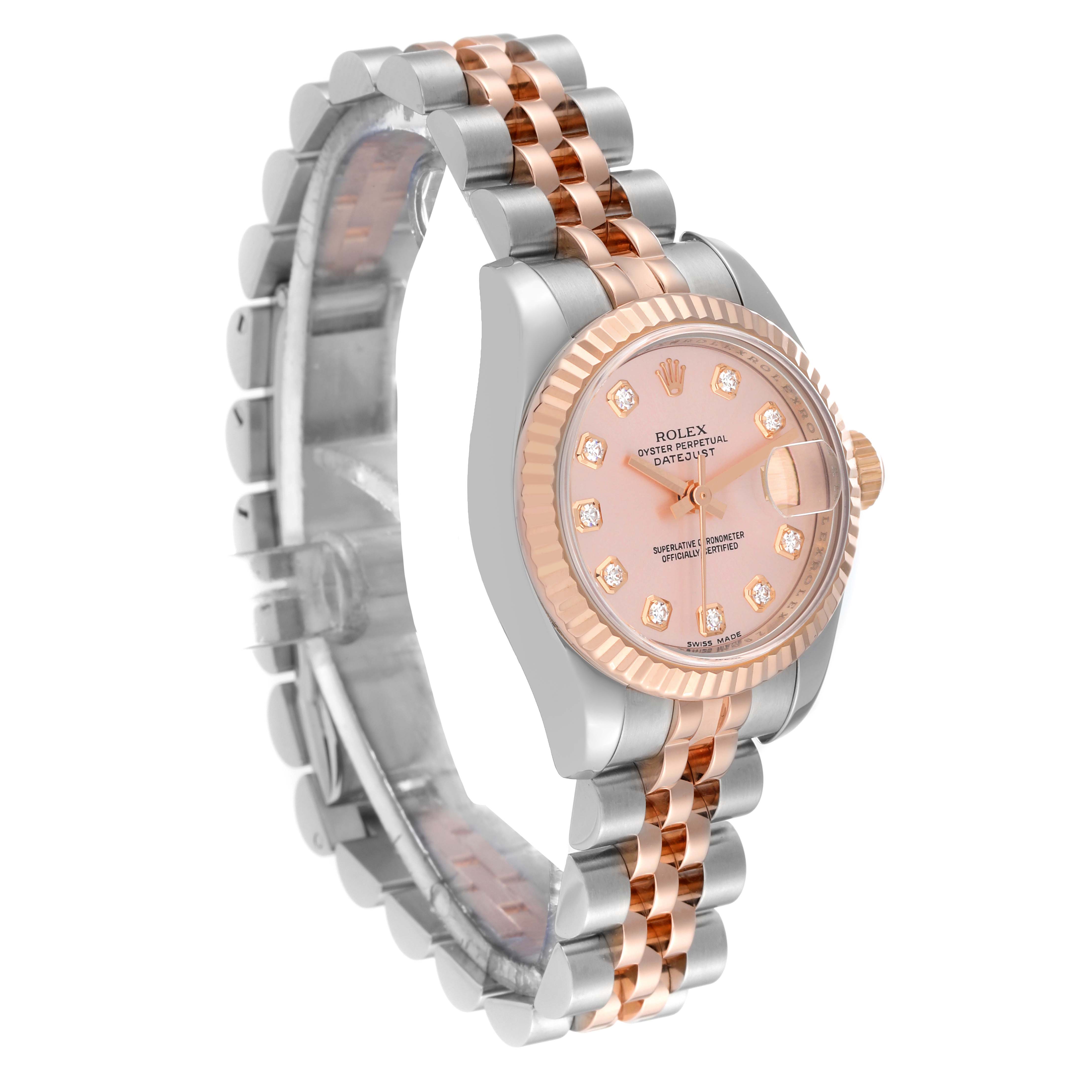 The image shows an angled view of a Rolex Datejust 179171 Women's Steel and Gold (two tone) Pink Dial 179171 Women's Steel and Gold (two tone) Pink Dial watch featuring its dial, case, and two-tone bracelet.