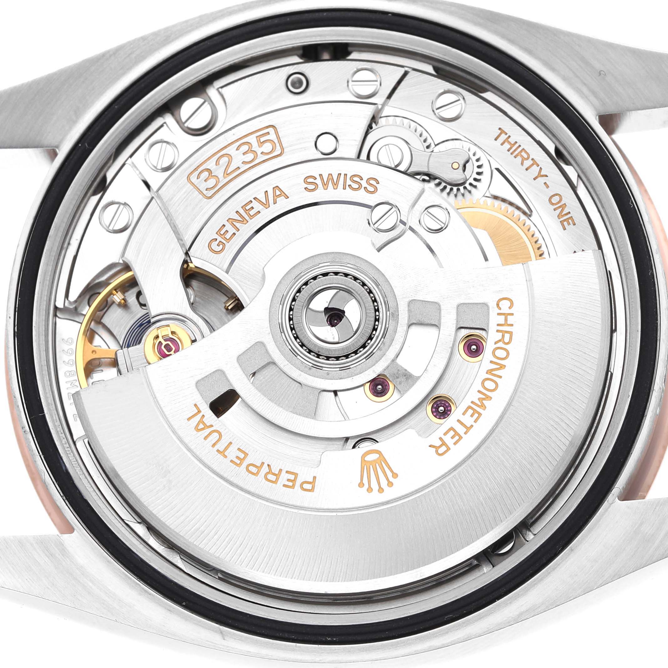 The image shows the back view of a Rolex Datejust 126231 Men's Steel and Gold (two tone) Grey Dial, highlighting its movement mechanism and rotor details.