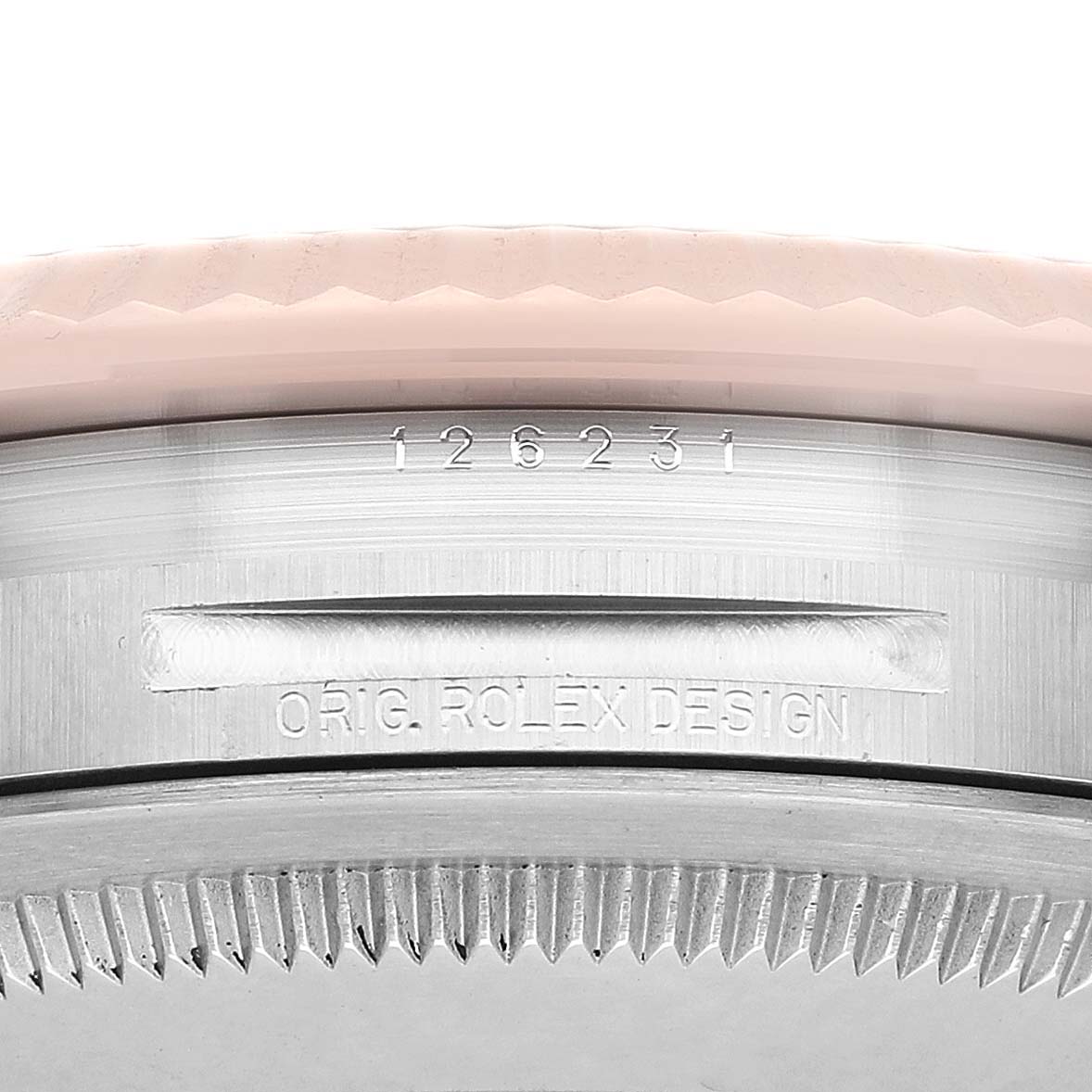 The image shows a close-up of the Rolex Datejust 126231 Men's Steel and Gold (two tone) Grey Dial bezel and case side with engraved details.