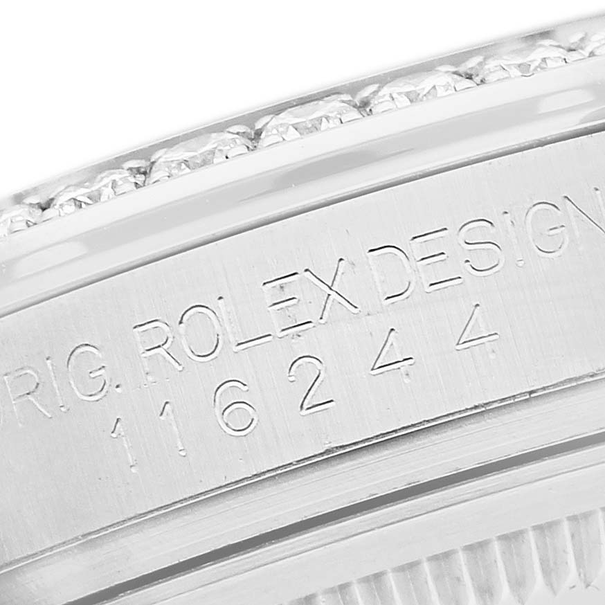 The image shows a close-up view of the engraving on the side of a Rolex Oyster Perpetual 116244 Men's Stainless Steel Mother of Pearl Dial watch, highlighting the model details.