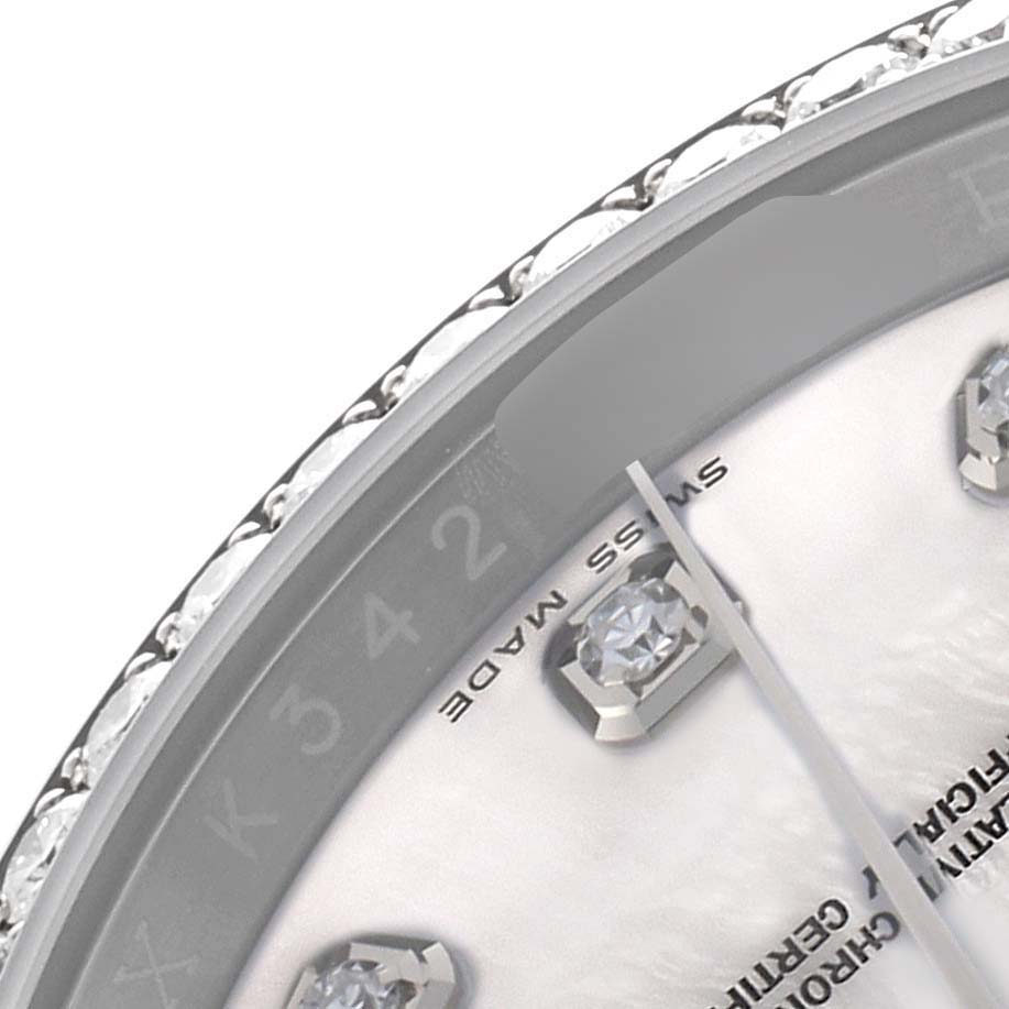 The image shows a close-up of the Rolex Oyster Perpetual 116244 Men's Stainless Steel Mother of Pearl Dial watch face, highlighting the bezel, dial, and part of the hour markers.