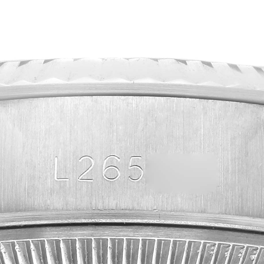 The image shows a close-up of the serial number engraving on the case side of a Rolex Datejust 69174 Women's Stainless Steel Silver Dial 69174 Women's Stainless Steel Silver Dial watch.