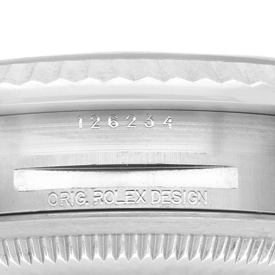 The image shows a close-up of the case edge with engraved text and serial number on a Rolex Datejust 126234 Men's Stainless Steel Grey Dial 126234 Men's Stainless Steel Grey Dial.
