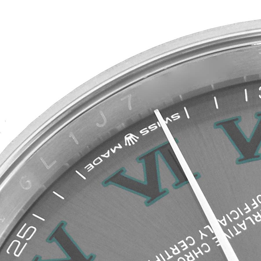 The image shows a close-up of the face and bezel of a Rolex Datejust 126234 Men's Stainless Steel Grey Dial 126234 Men's Stainless Steel Grey Dial, focusing on numbers and text.