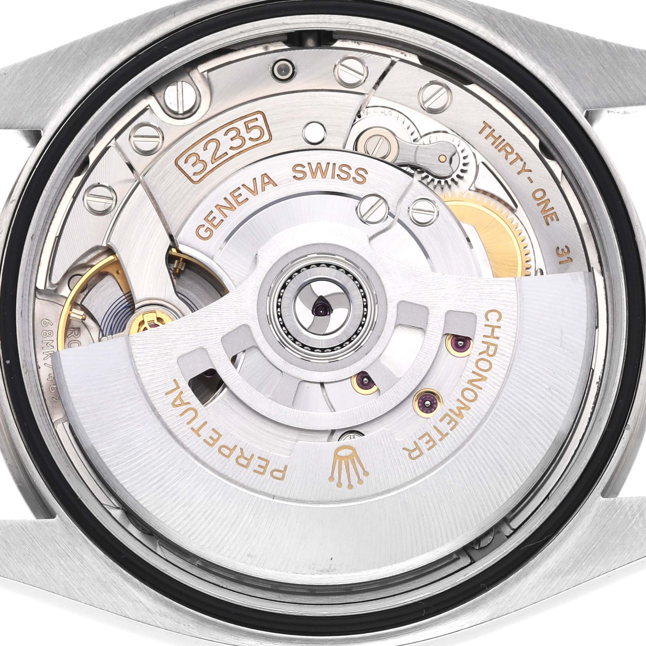 The image shows a close-up of the Rolex Datejust 126234 Men's Stainless Steel Grey Dial 126234 Men's Stainless Steel Grey Dial's movement, highlighting the rotor and visible gears.