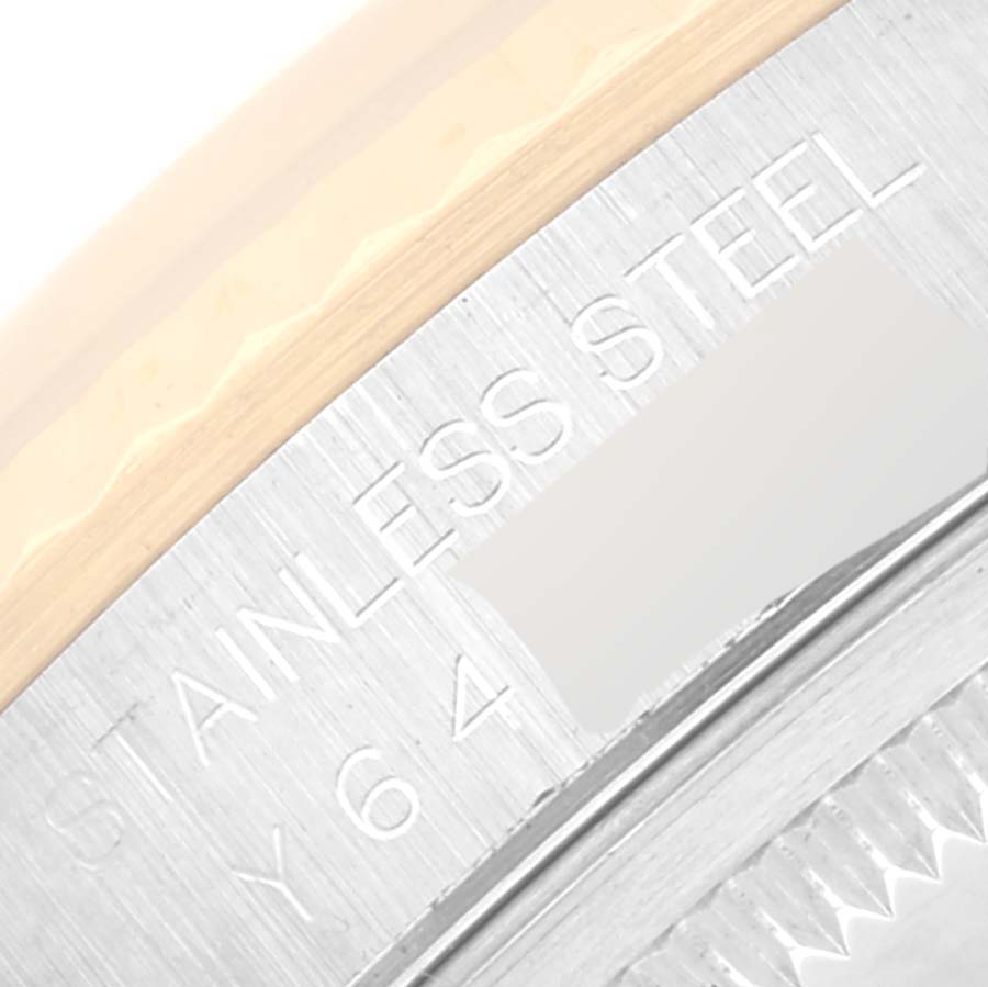 This image shows a close-up of the side engraving on the stainless steel case back of a Rolex Datejust 16233 Men's Steel and Gold (two tone) Beige Dial 16233 Men's Steel and Gold (two tone) Beige Dial watch.