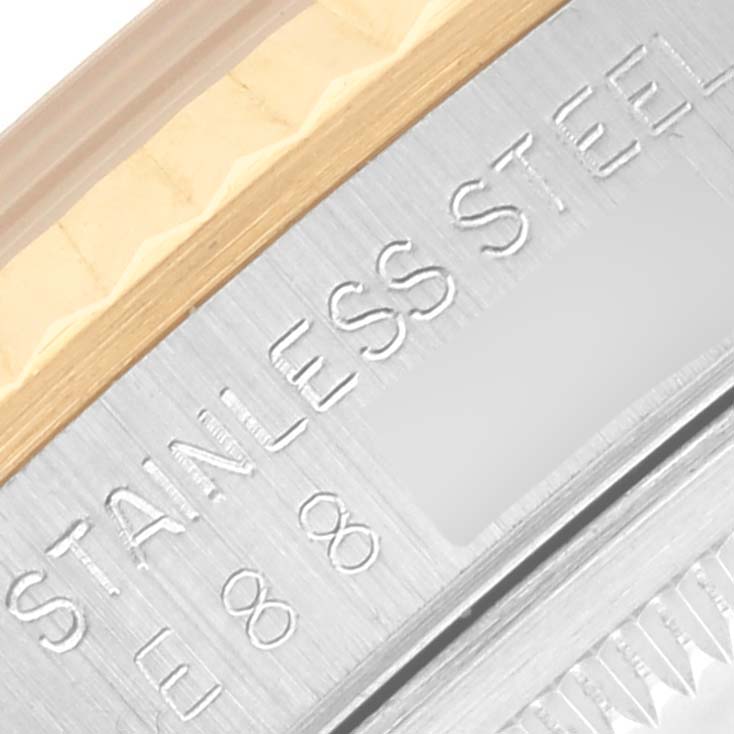 The image shows a close-up of the side of a Rolex Datejust 16233 Men's Steel and Gold (two tone) White Dial 16233 Men's Steel and Gold (two tone) White Dial, highlighting the stainless steel and a portion of the bezel.