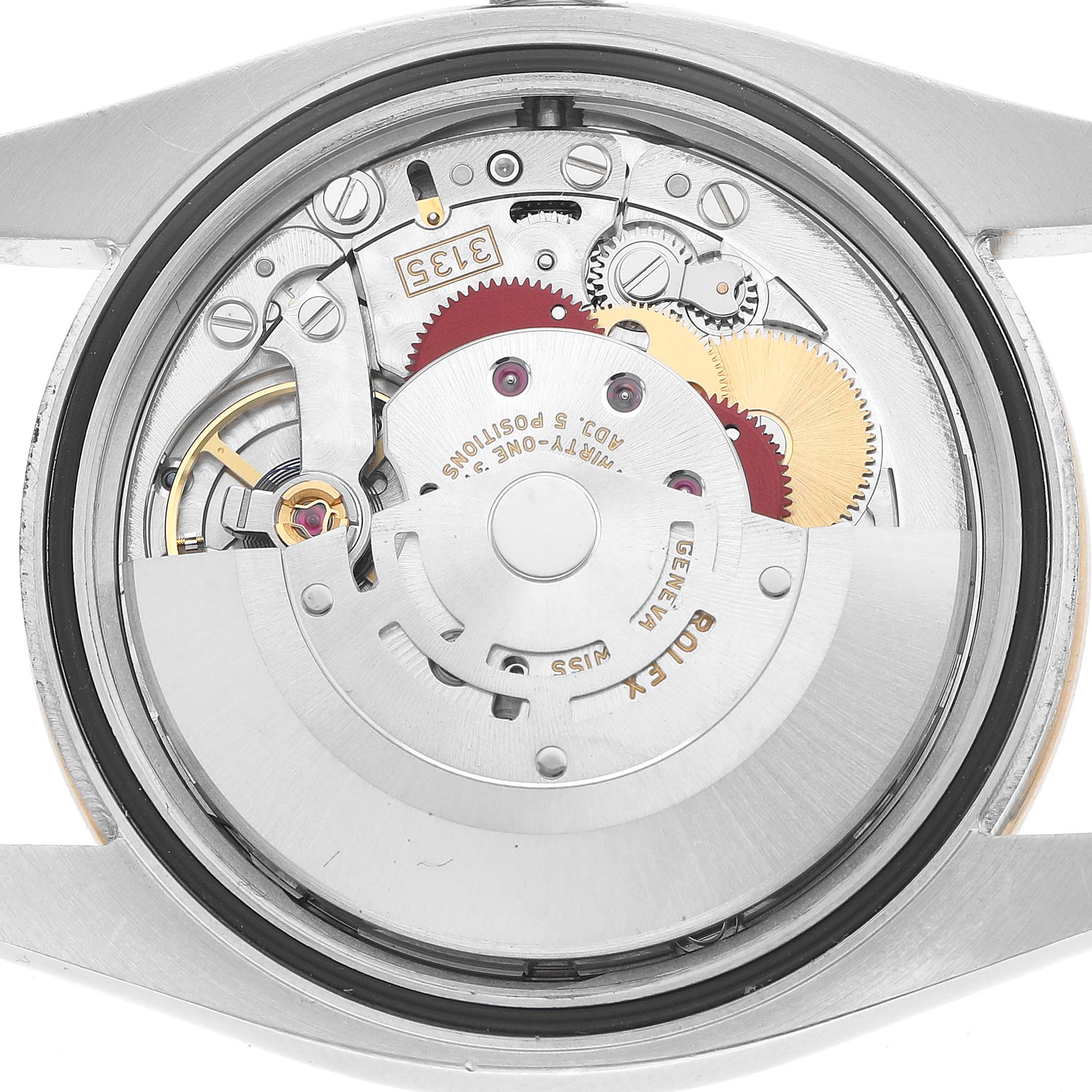 The image shows the movement of a Rolex Datejust 116243 Men's Steel and Gold (two tone) Mother of Pearl Dial, highlighting gears and components from a rear angle.