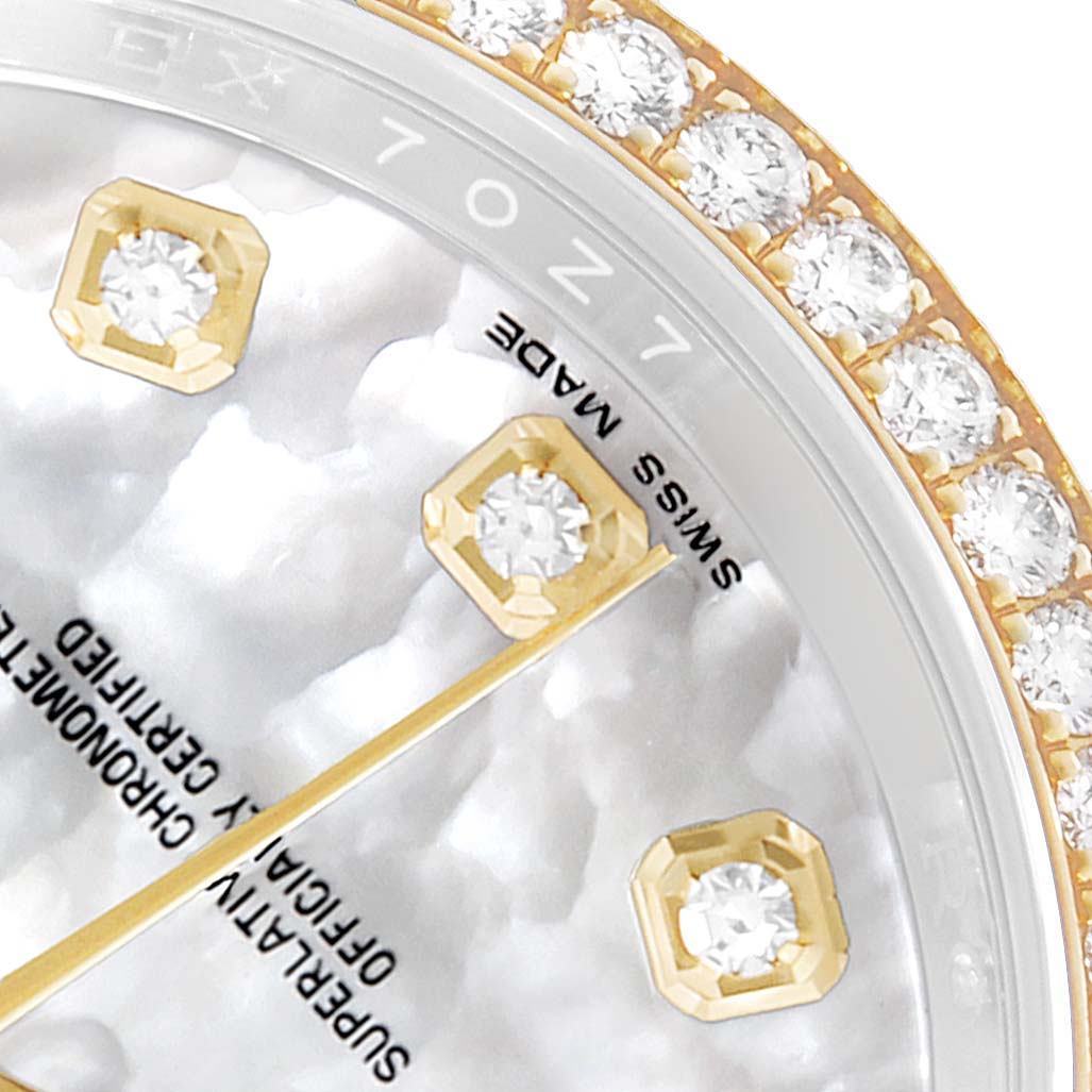 The image shows a close-up of a Rolex Datejust 116243 Men's Steel and Gold (two tone) Mother of Pearl Dial watch with a diamond-studded bezel and indices from a top angle.