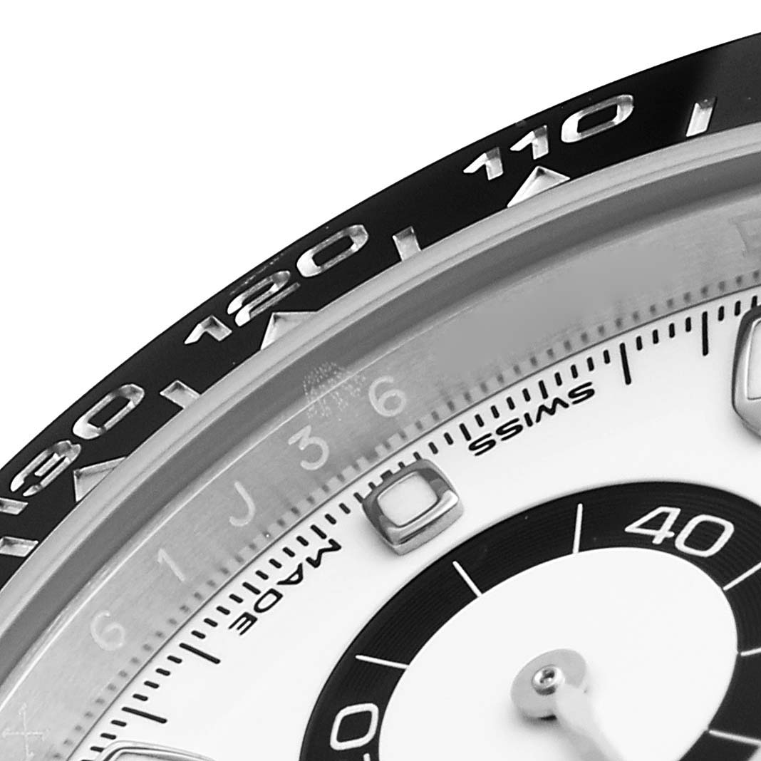 This close-up image shows the bezel and dial details of a Rolex Daytona 116500 Men's Stainless Steel White Dial 116500 Men's Stainless Steel White Dial watch, displaying the tachymeter and minute markers.