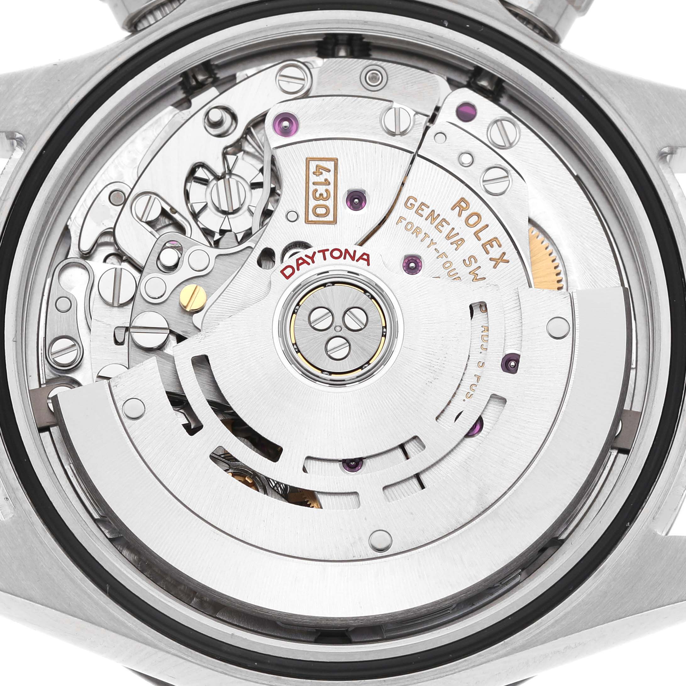 The image shows the movement of a Rolex Daytona 116500LN Men's Stainless Steel Black Dial watch from a rear angle, highlighting its intricate mechanism.