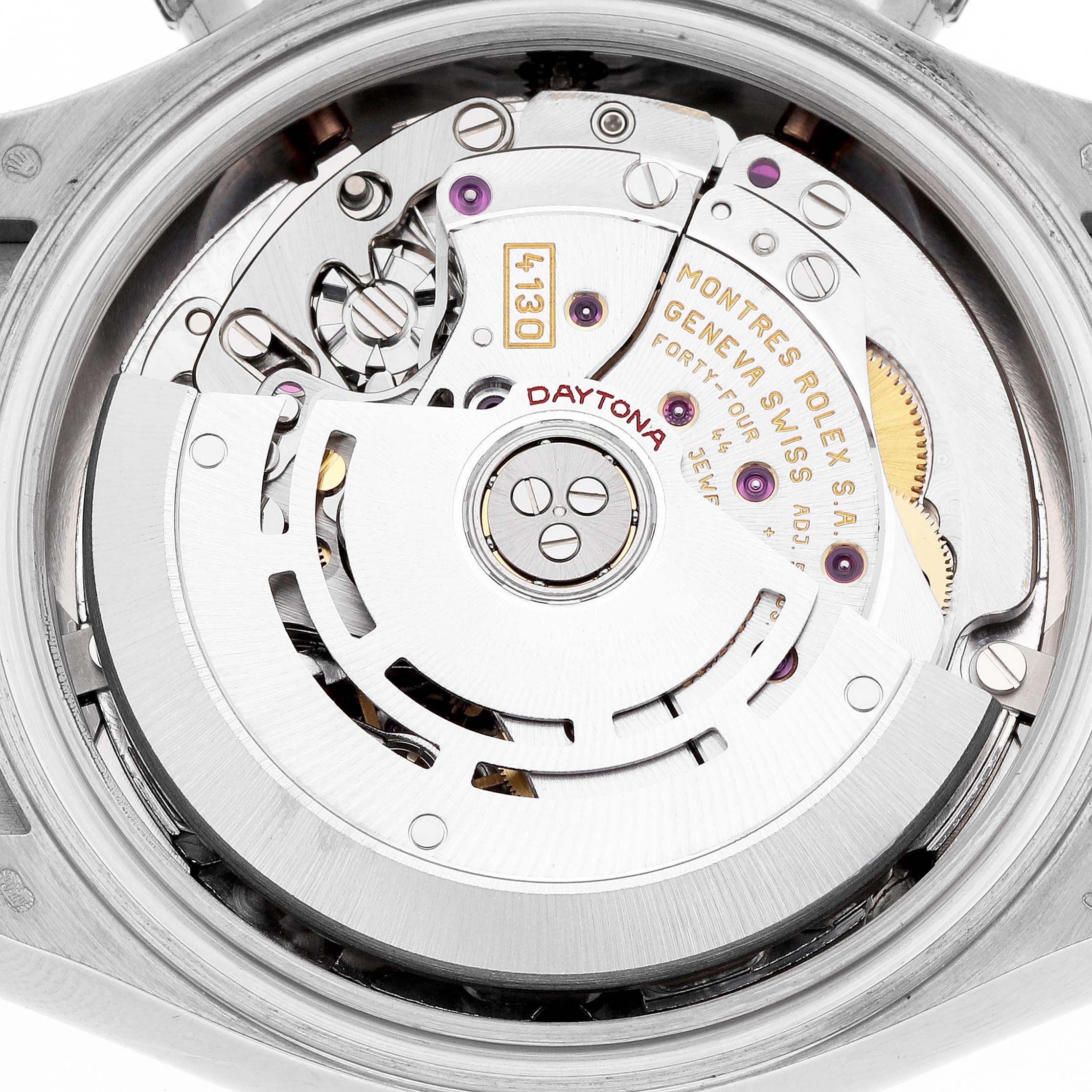 The image shows the movement of a Rolex Daytona 116519 Men's White Gold Silver Dial watch, highlighting the intricate rotor and gears from the back view.