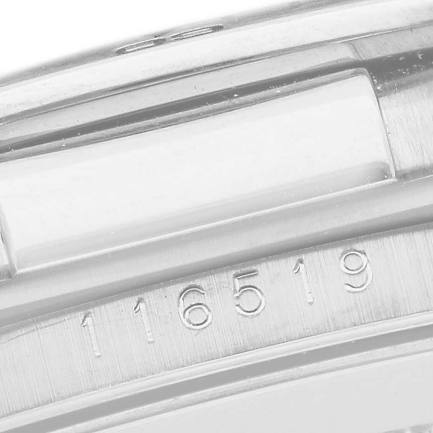 The image shows a partial close-up of the Rolex Daytona 116519 Men's White Gold Silver Dial model's case and bezel, highlighting the model number 116519.