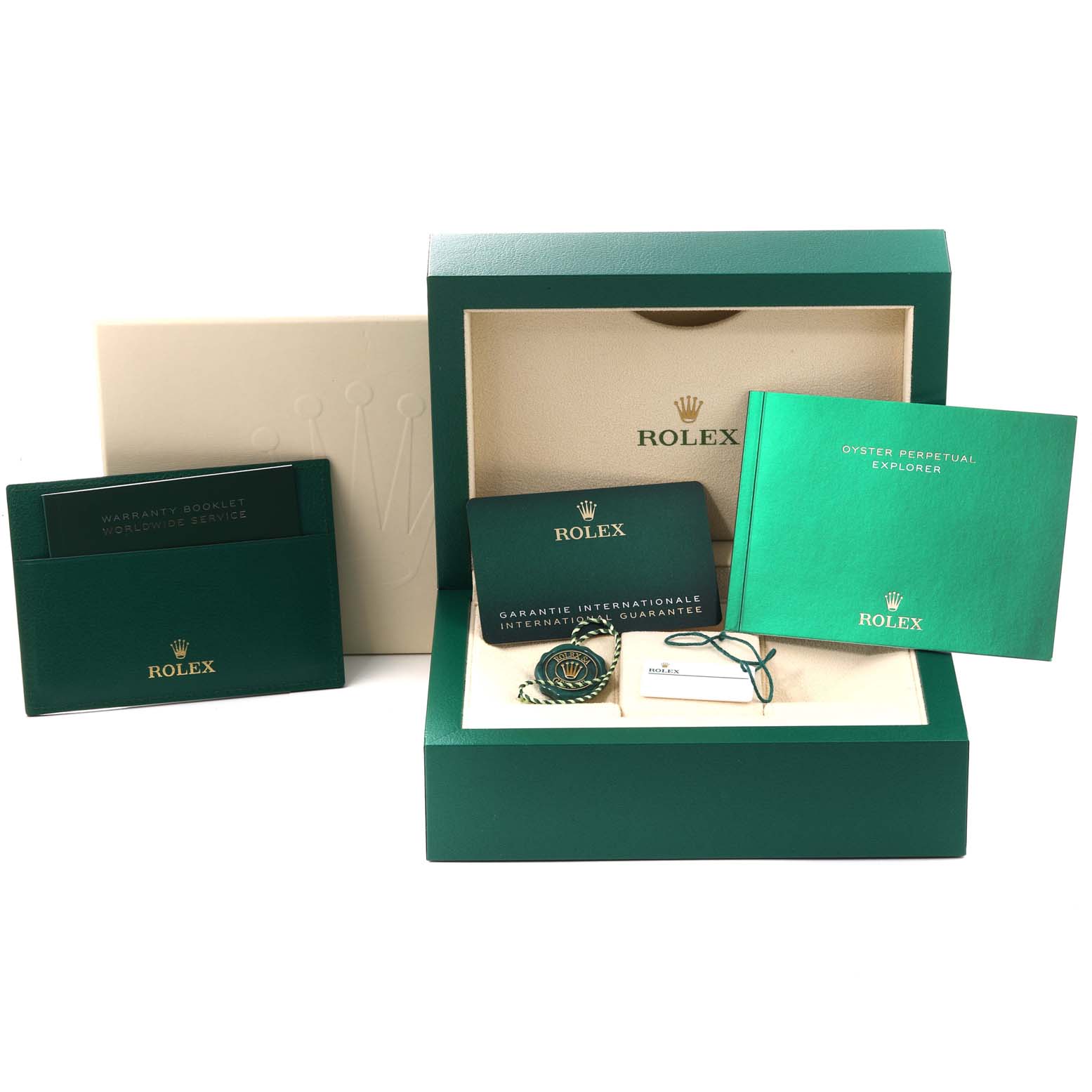 The image shows Rolex Explorer 124270 Men
s Stainless Steel Black Dial 124270 Men
s Stainless Steel Black Dial packaging including the box, manuals, warranty card, and accessories.