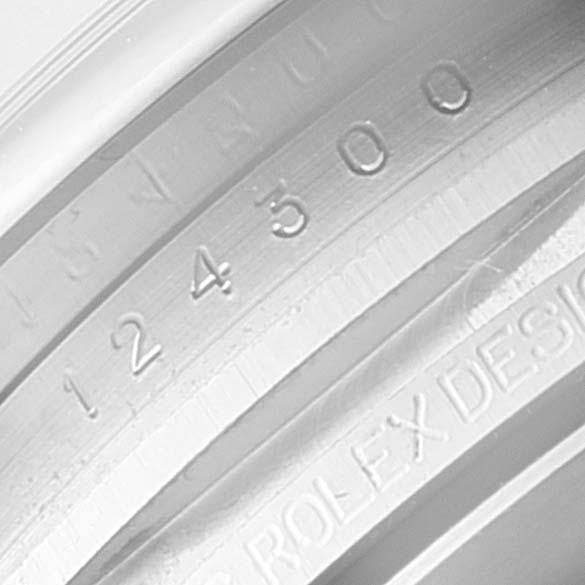 The image shows a close-up of the inner bezel and serial number of a Rolex Oyster Perpetual 124300 Men
s Stainless Steel Silver Dial 124300 Men
s Stainless Steel Silver Dial watch.