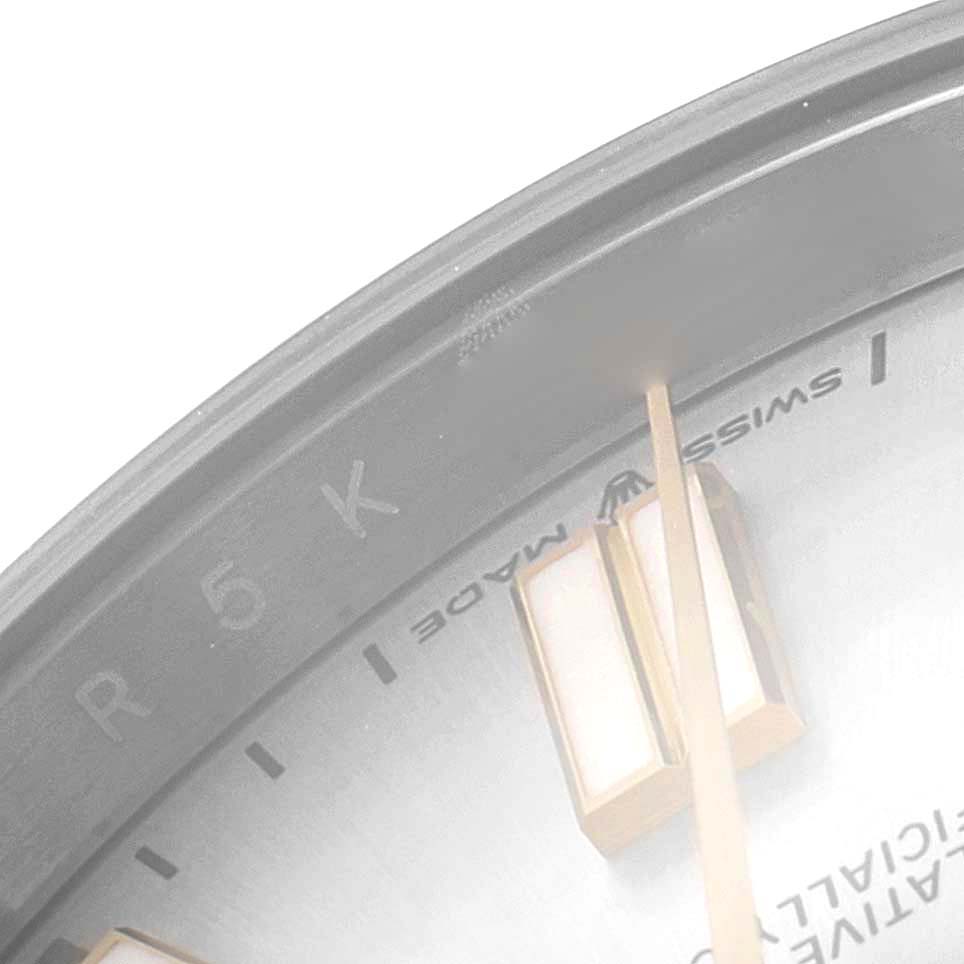 This close-up image shows the dial and part of the bezel of a Rolex Oyster Perpetual 124300 Men
s Stainless Steel Silver Dial 124300 Men
s Stainless Steel Silver Dial watch, including the "Swiss Made" text.