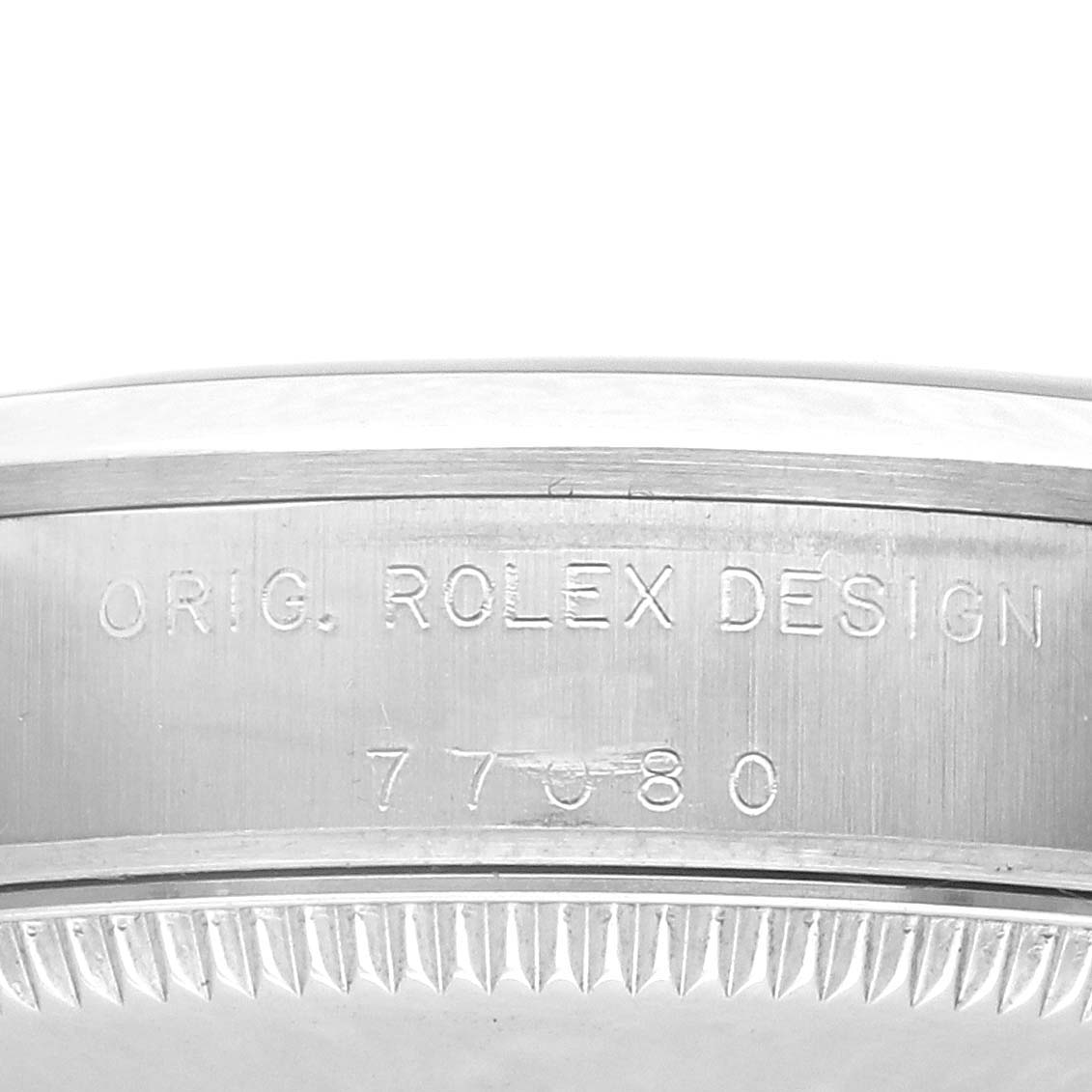 The image shows the side view of the Rolex Mid-Size 77080 Women's Stainless Steel Pink Dial 77080 Women's Stainless Steel Pink Dial watch case with engraving "Orig. Rolex Design 77880."