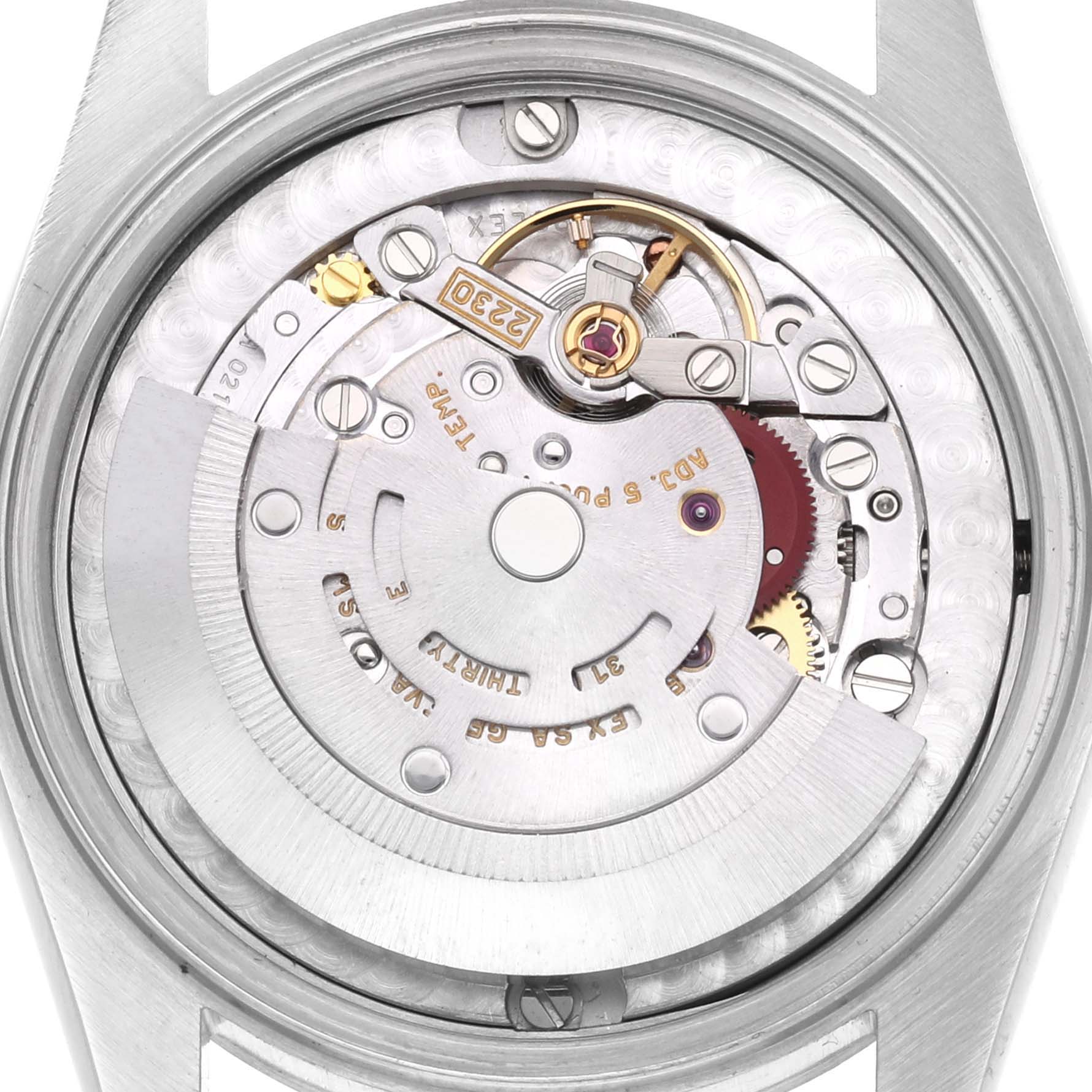 The image shows the movement of a Rolex Mid-Size 77080 Women's Stainless Steel Pink Dial 77080 Women's Stainless Steel Pink Dial watch from a top-down angle, highlighting its intricate components.