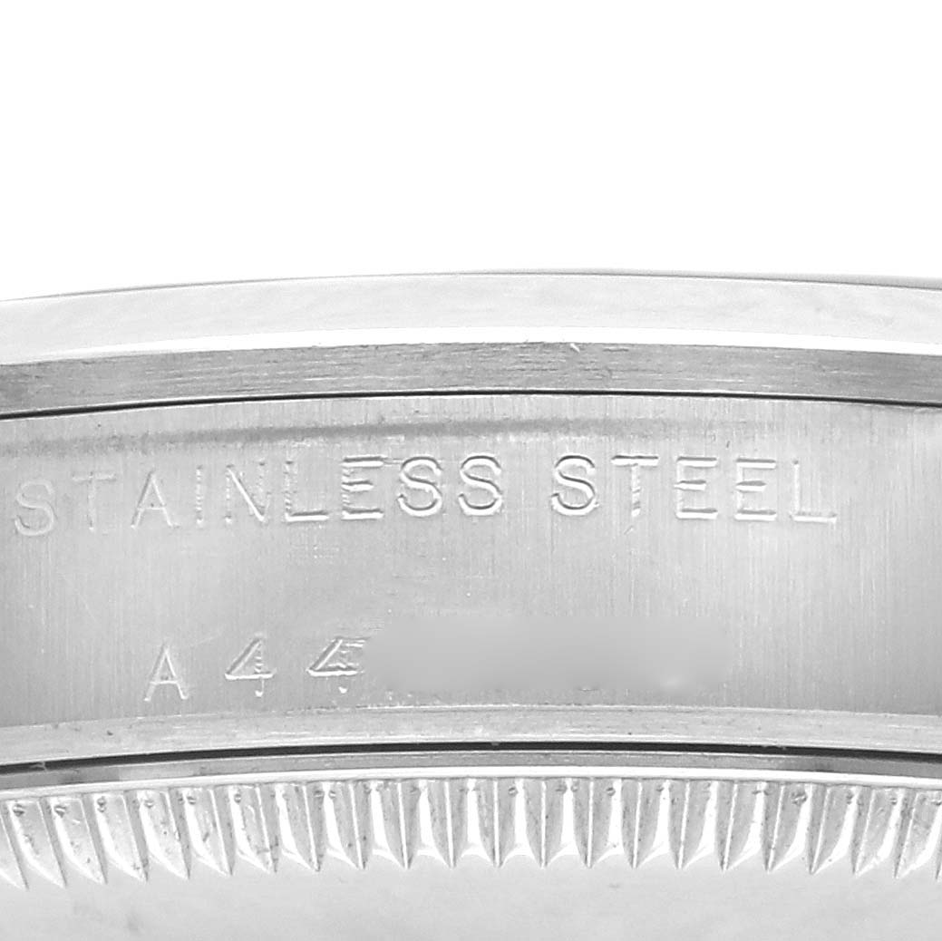 The image shows the side profile of a Rolex Mid-Size 77080 Women's Stainless Steel Pink Dial 77080 Women's Stainless Steel Pink Dial model's stainless steel case, highlighting the engraved details.