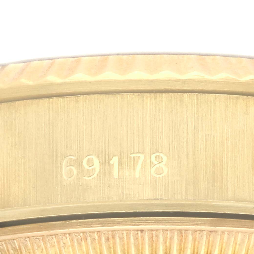 The image shows a close-up of the Rolex President 69178 Women's Yellow Gold Black Dial 69178 Women's Yellow Gold Black Dial model's case edge and part of the bezel, highlighting the model number 69178.