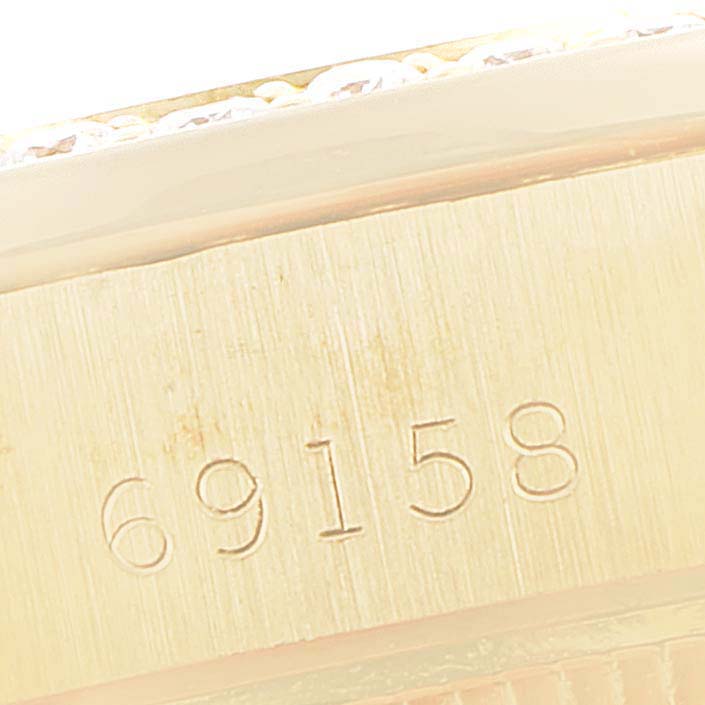 This close-up image showcases the model number "69158" engraved on the side of a Rolex President 69158 Women
s Yellow Gold Champagne Dial 69158 Women
s Yellow Gold Champagne Dial watch.