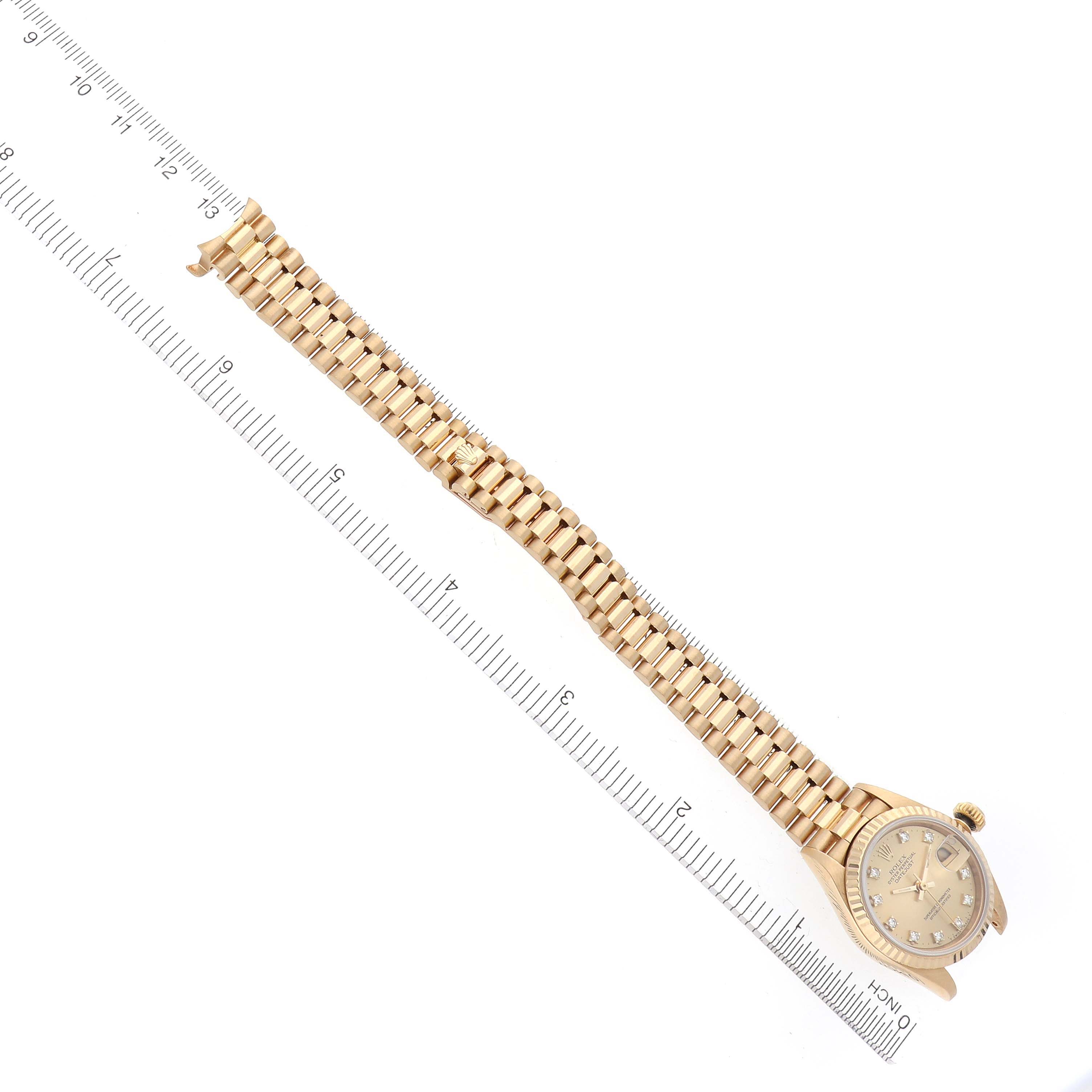 The image shows the Rolex President 69178 Women's Yellow Gold Champagne Dial 69178 Women's Yellow Gold Champagne Dial model watch from an overhead angle, highlighting the full bracelet and watch face.