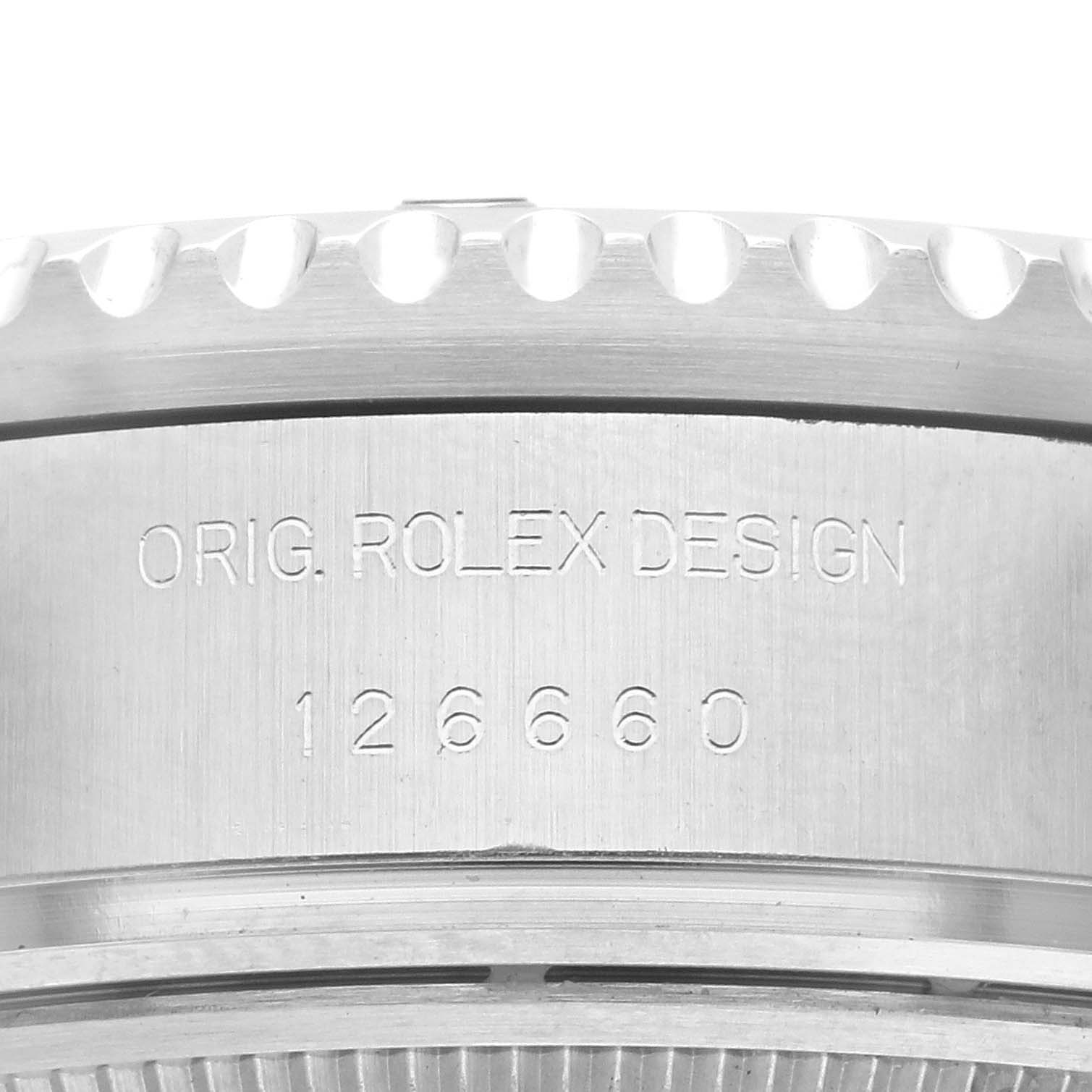 The image shows the side profile of the Rolex Sea-Dweller 126660 Men
s Stainless Steel Blue Dial 126660 Men
s Stainless Steel Blue Dial with engravings "ORIG. ROLEX DESIGN" and "126660."