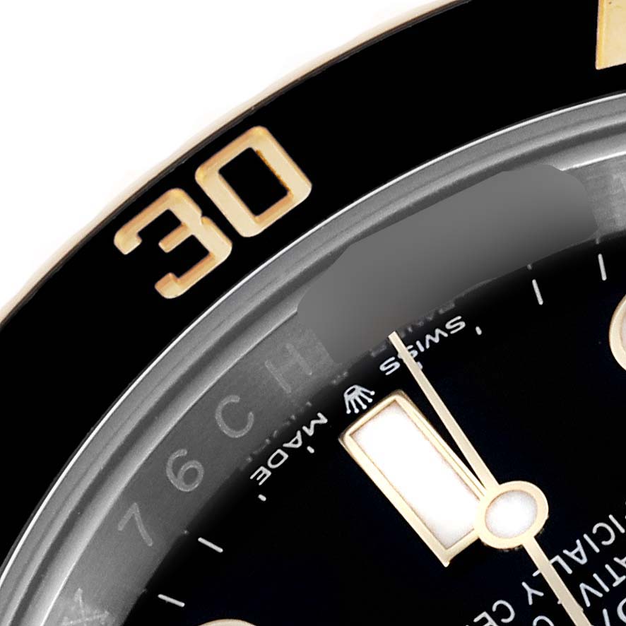 The image shows a close-up of the Rolex Submariner 126613LN Men's Steel and Gold (two tone) Black Dial 126613LN Men's Steel and Gold (two tone) Black Dial's bezel and part of the dial, displaying the 30 mark.
