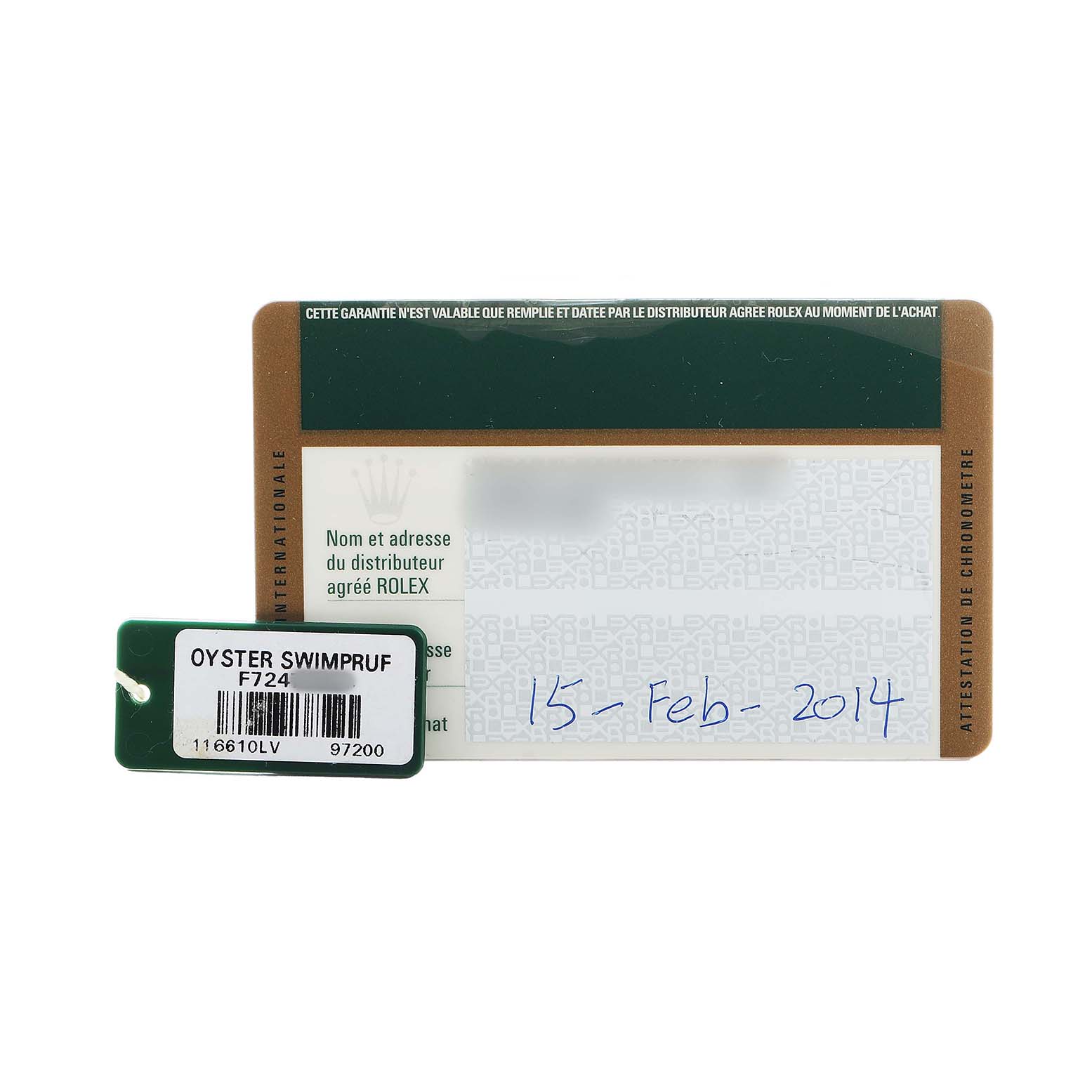 The image shows a warranty card and tag for a Rolex Submariner 116610LV Men's Stainless Steel Green Dial, featuring model details and a date written on the card.