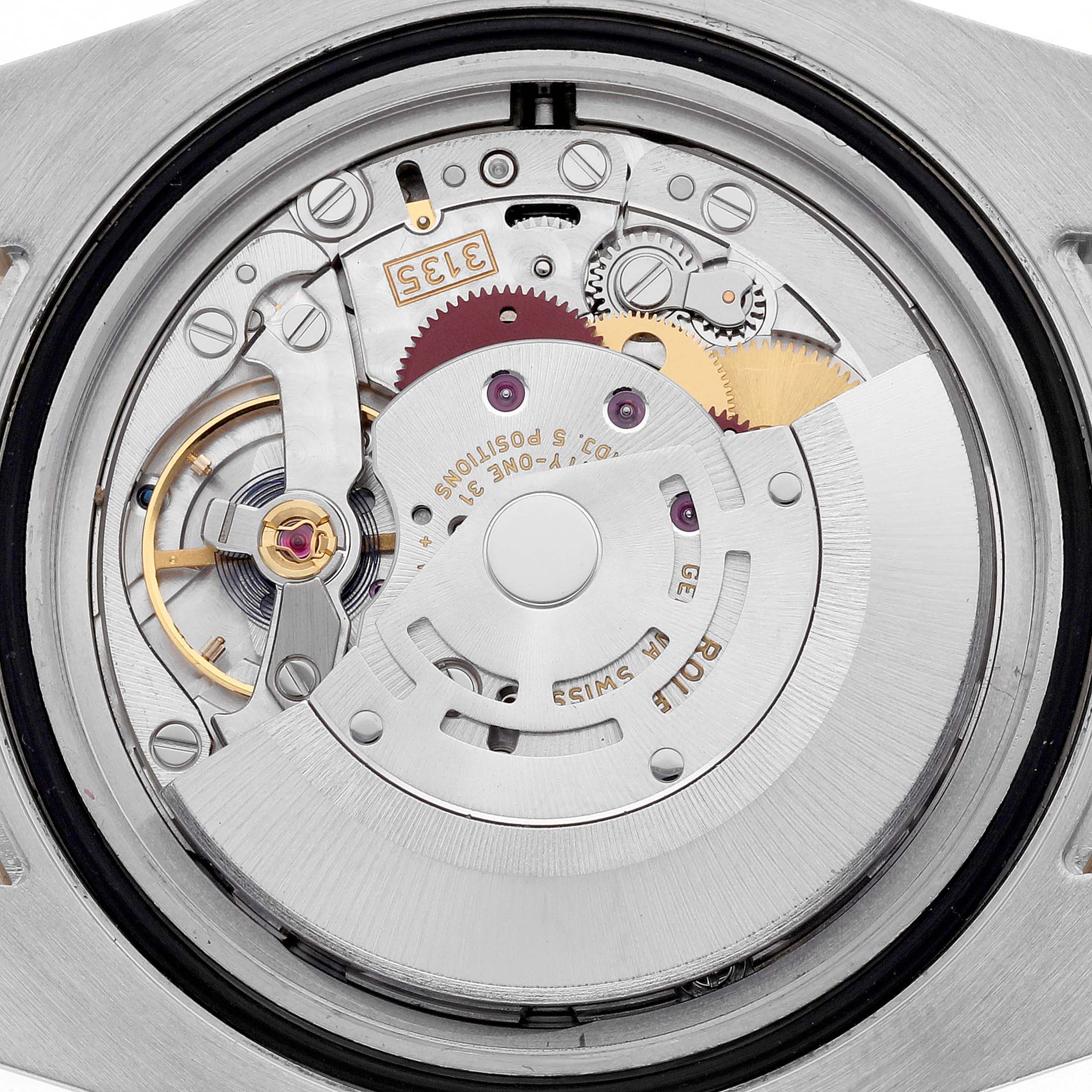 The image shows the internal movement with gears and mechanisms of a Rolex Submariner 116613LB Men's Steel and Gold (two tone) Blue Dial 116613LB Men's Steel and Gold (two tone) Blue Dial watch from the back.