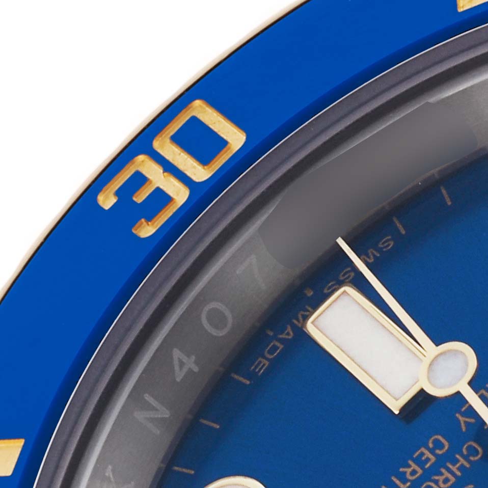 The close-up image shows the blue bezel and dial of a Rolex Submariner 116613LB Men's Steel and Gold (two tone) Blue Dial 116613LB Men's Steel and Gold (two tone) Blue Dial, highlighting the gold "30" marker and part of the watch face.
