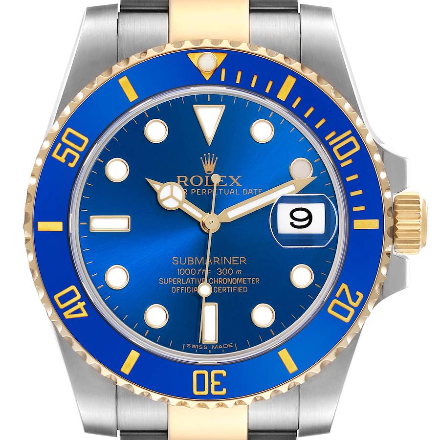 The Rolex Submariner is shown from a top view, highlighting the blue and gold bezel, dial, and part of the bracelet.