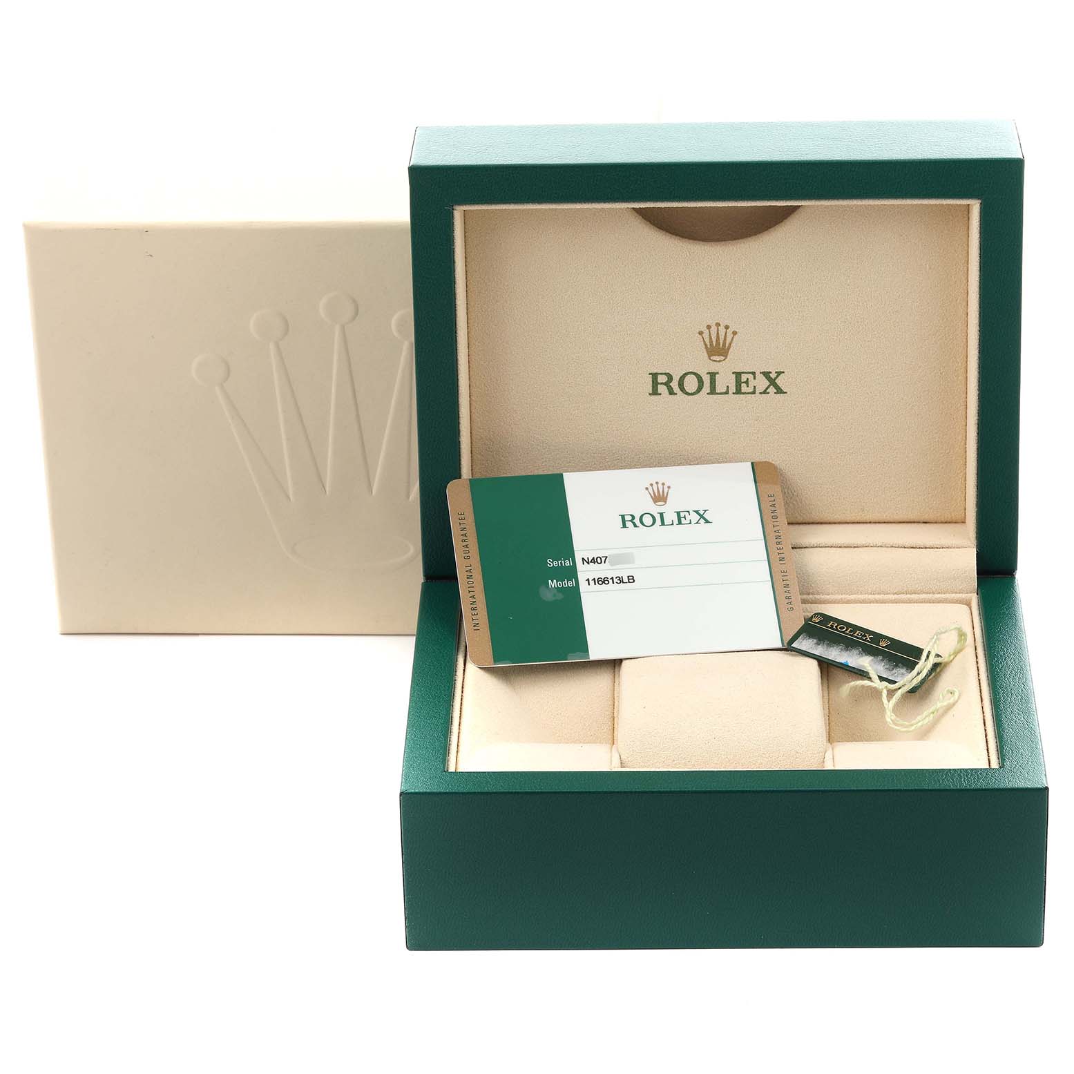 This image shows the packaging, warranty card, and tag for a Rolex Submariner 116613LB Men's Steel and Gold (two tone) Blue Dial 116613LB Men's Steel and Gold (two tone) Blue Dial watch.