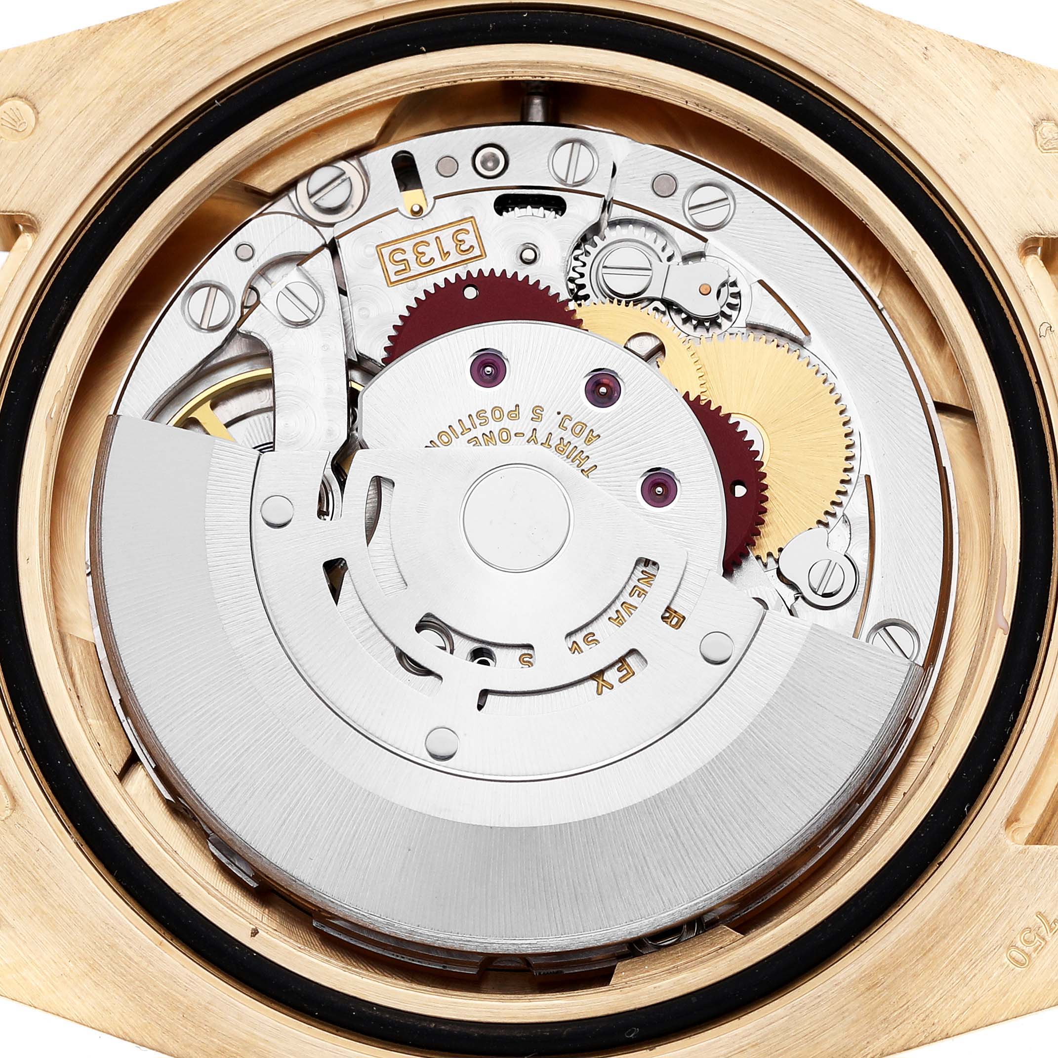 The image shows a close-up of the movement inside a Rolex Submariner 116618LB Men's Yellow Gold Blue Dial, highlighting gears and internal mechanics.
