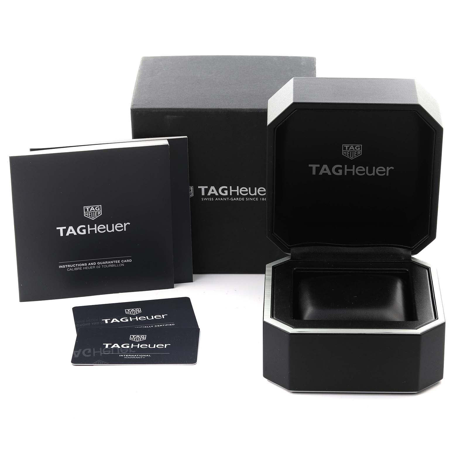 The image shows a Tag Heuer Carrera CAR5A8Y.FC6377 Men's Titanium Transparent Dial CAR5A8Y.FC6377 Men's Titanium Transparent Dial watch box, instruction booklets, and guarantee cards from a frontal angle.