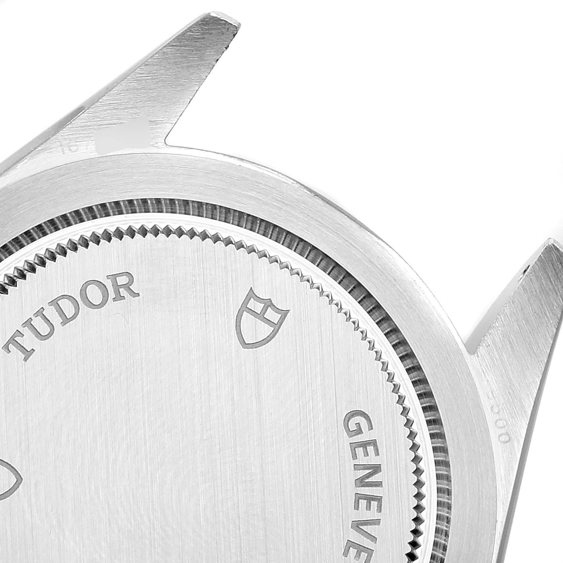 The image shows the caseback and lugs of a Tudor Heritage Black Bay 79500 Men
s Stainless Steel Black Dial 79500 Men
s Stainless Steel Black Dial watch from a close-up angle.