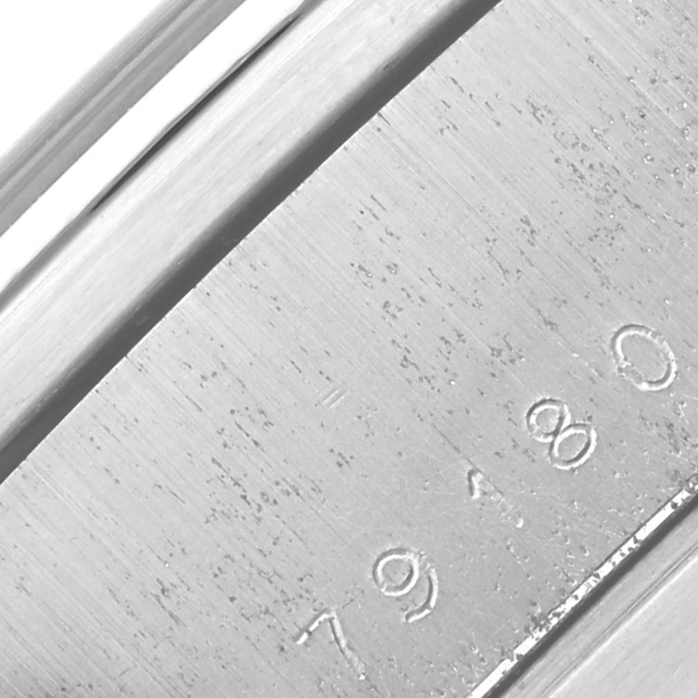 The image shows a close-up of the engraved case back edge of a Tudor Prince 79180 Men's Stainless Steel Black Dial 79180 Men's Stainless Steel Black Dial watch.