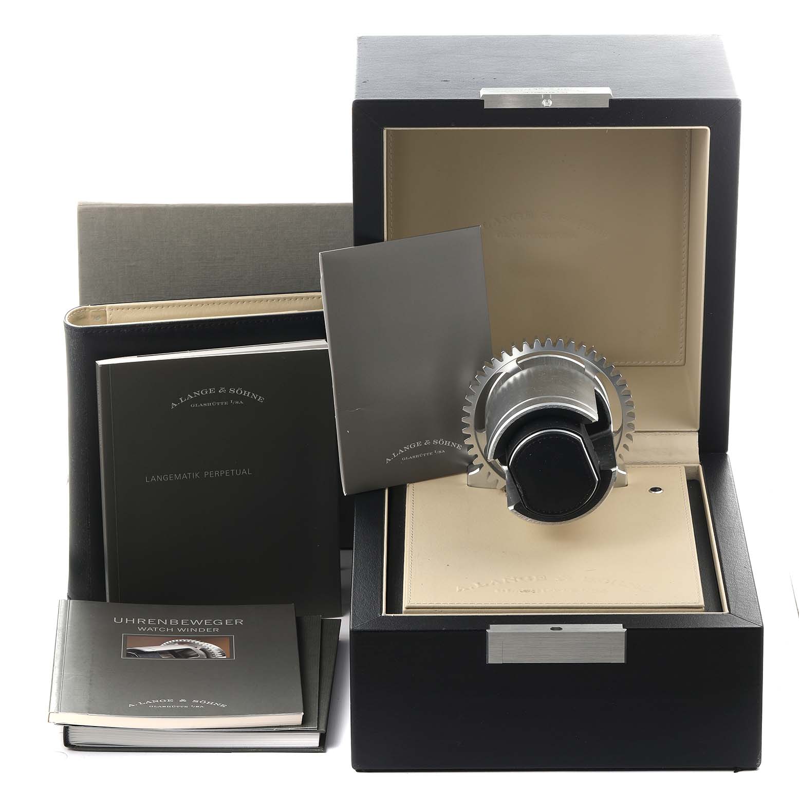 The image shows a Richard Lange model display box by A. Lange & Söhne with manuals and a watch winder.