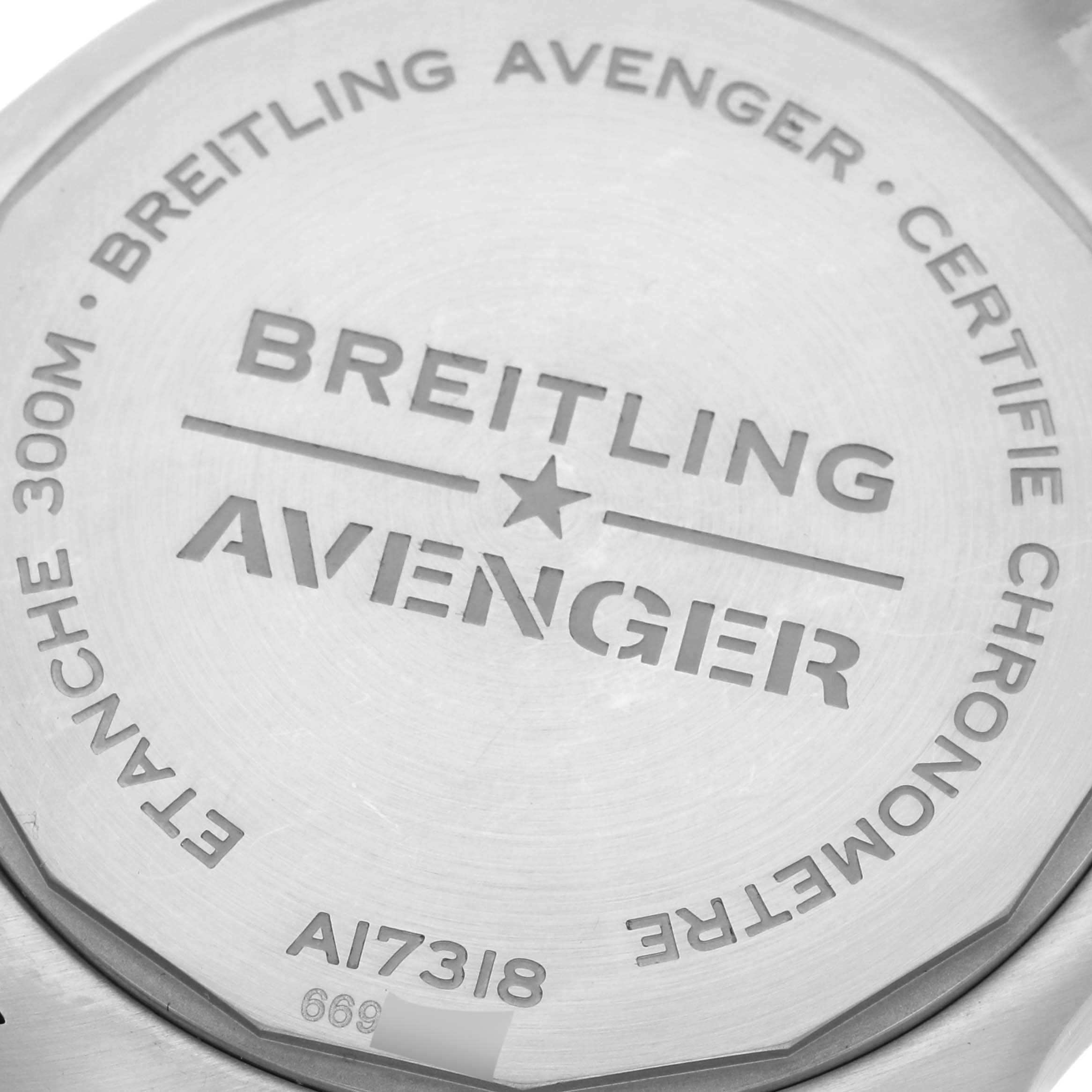 The image shows the back case of a Breitling Avenger A17318101C1A1 Men's Stainless Steel Blue Dial A17318101C1A1 Men's Stainless Steel Blue Dial watch, detailing its model and features.