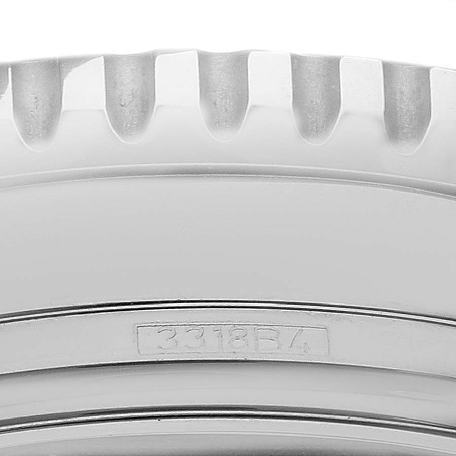 This close-up image shows the bezel and part of the engraved serial number on a Breitling Navitimer A13324 Men
s Stainless Steel Black Dial A13324 Men
s Stainless Steel Black Dial watch.