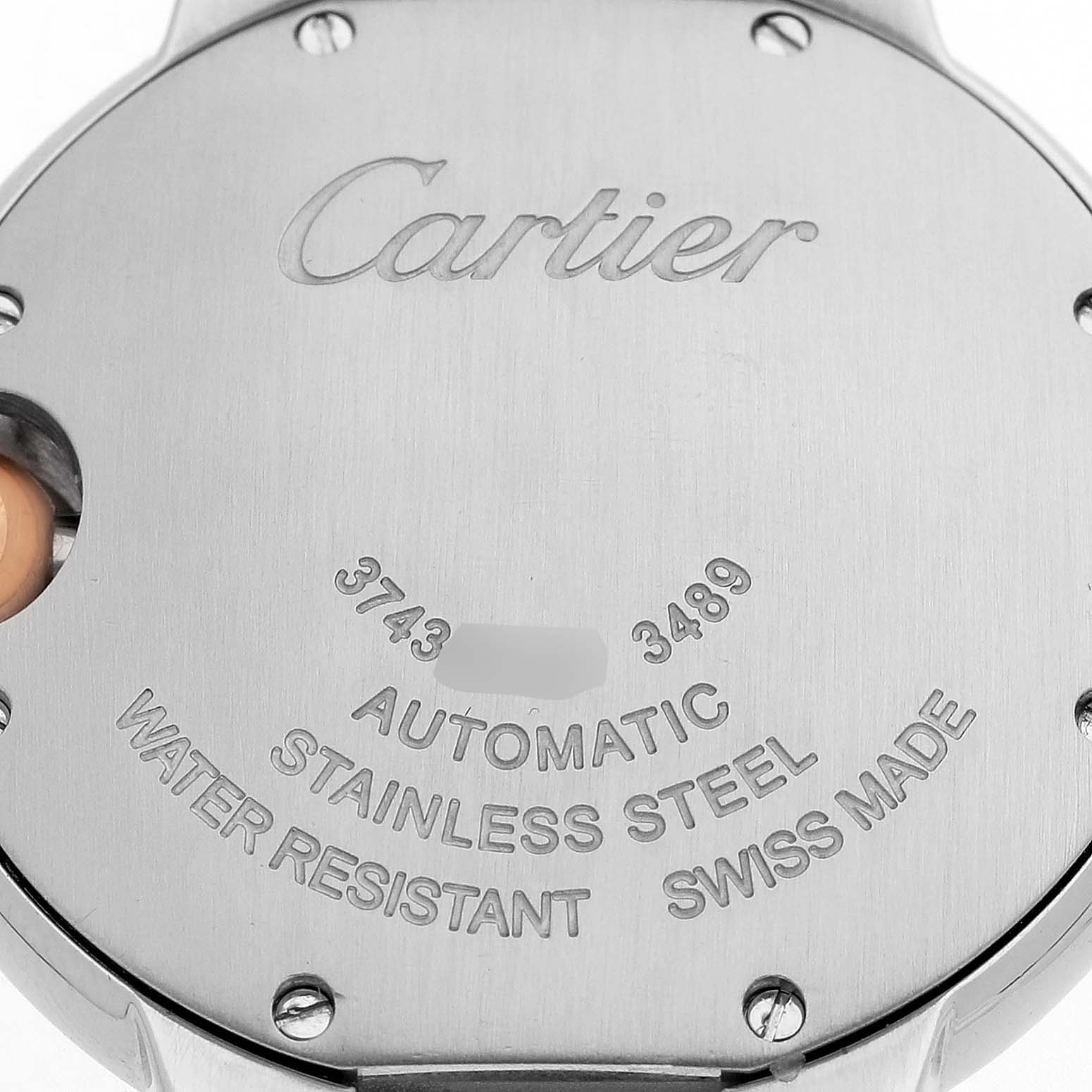 The image shows the back case of a Cartier Ballon Bleu WE902053 Women's Stainless Steel Pink Dial watch, highlighting the brand name and specifications.