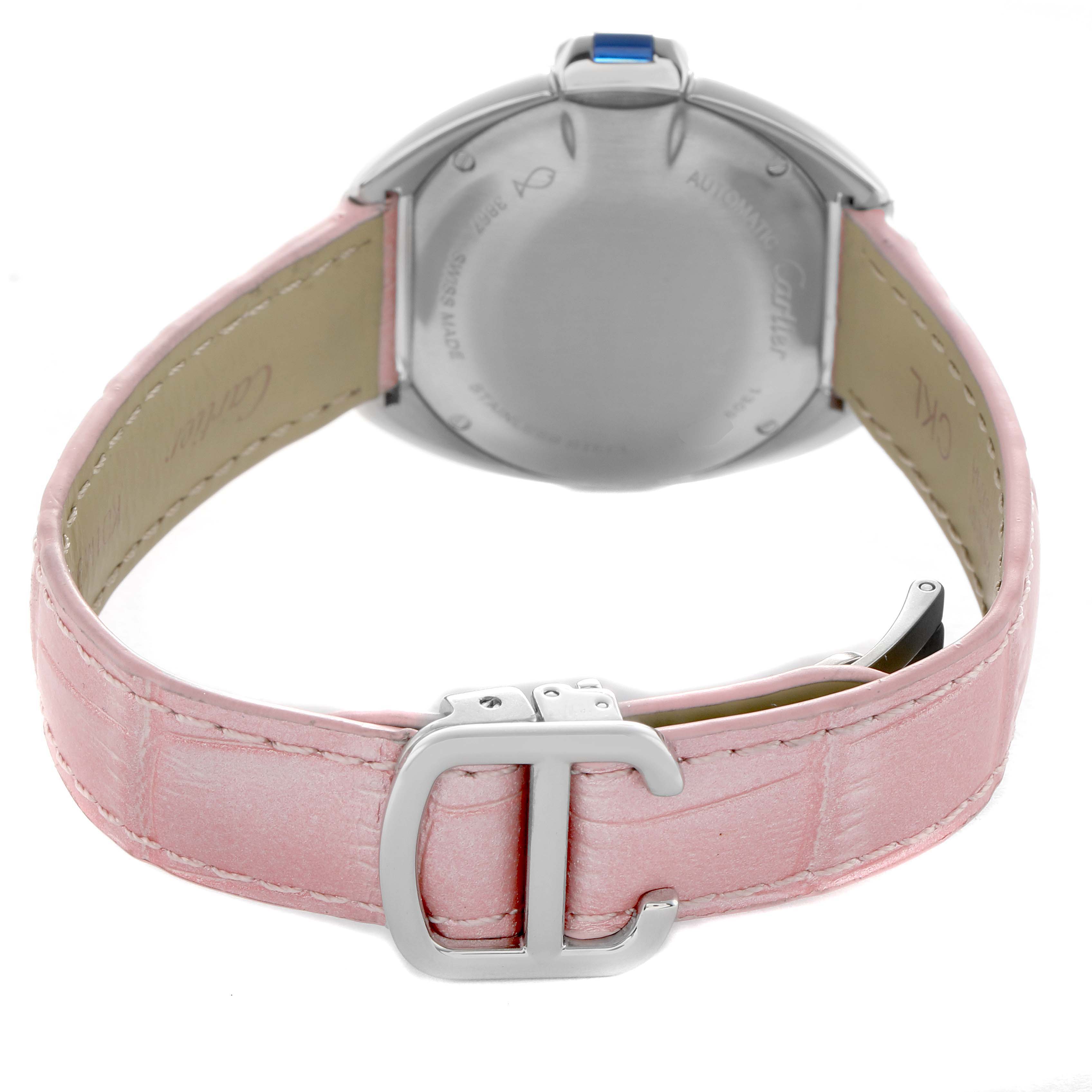 The image shows the back of a Cartier Clé watch with a pink leather strap and a visible clasp.
