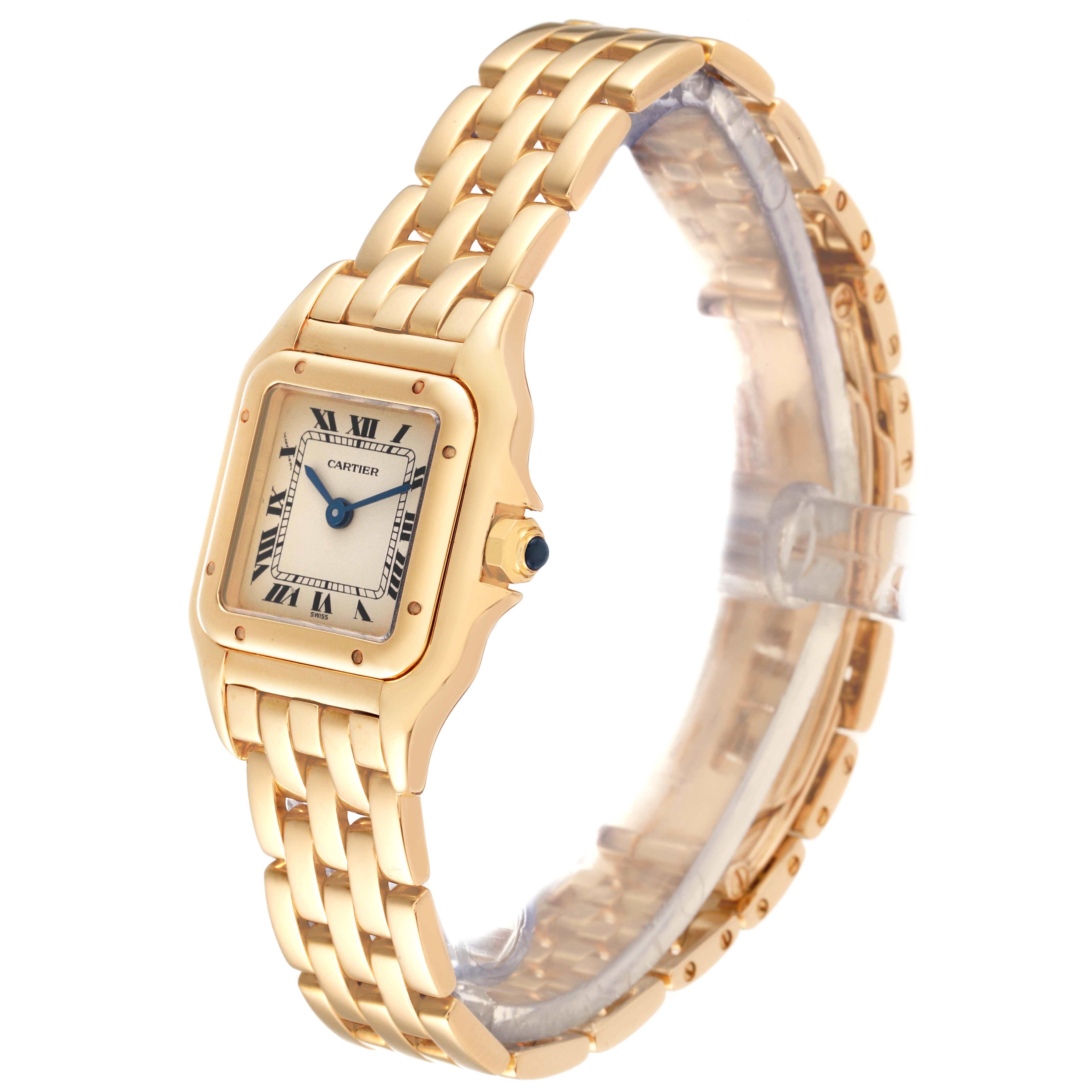 This image shows a side view of the Cartier Panthère watch, highlighting its gold bracelet, square face, and blue cabochon crown.