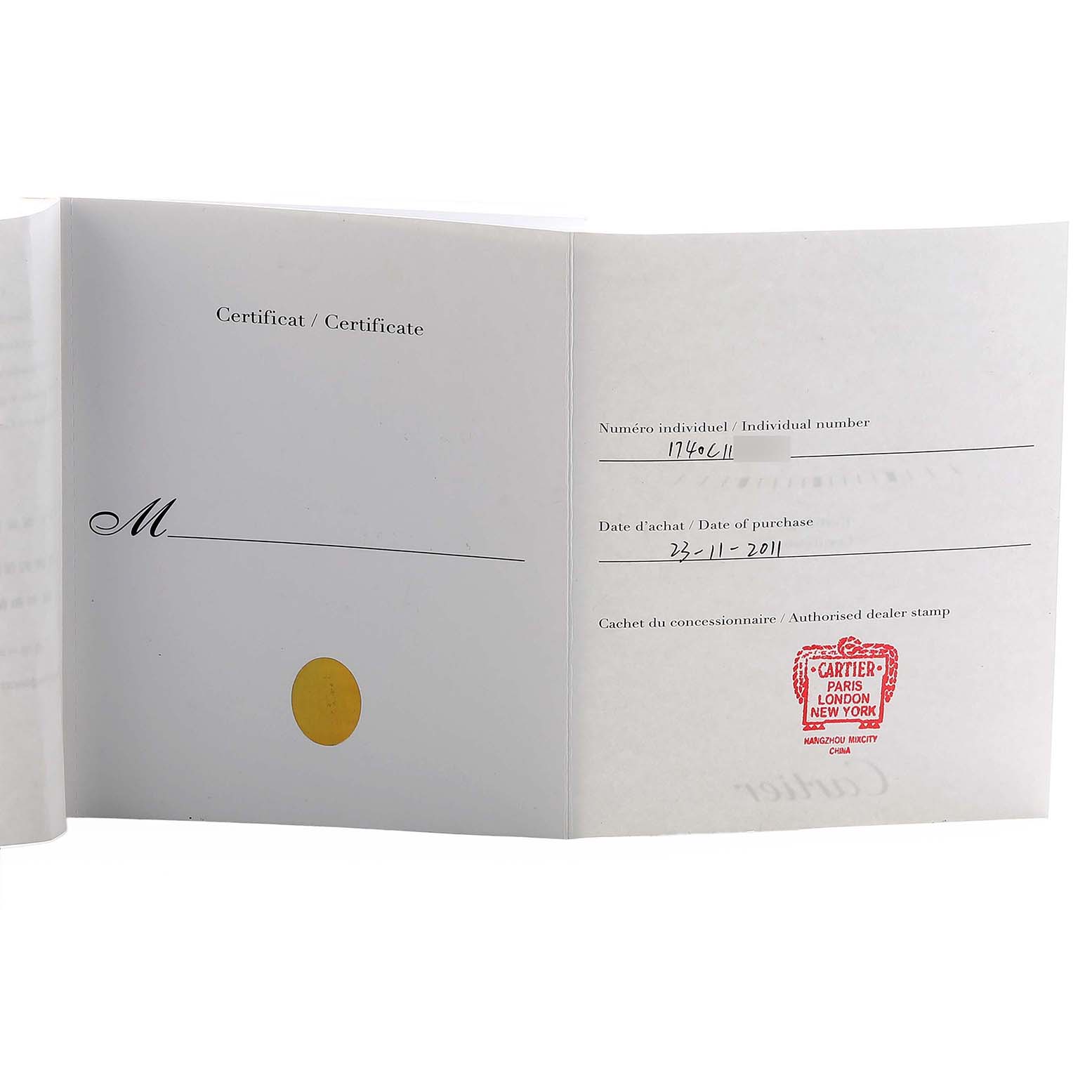 The image shows the Certificate of Authenticity for the Cartier Tank Américaine, displaying the dealer stamp and purchase date.