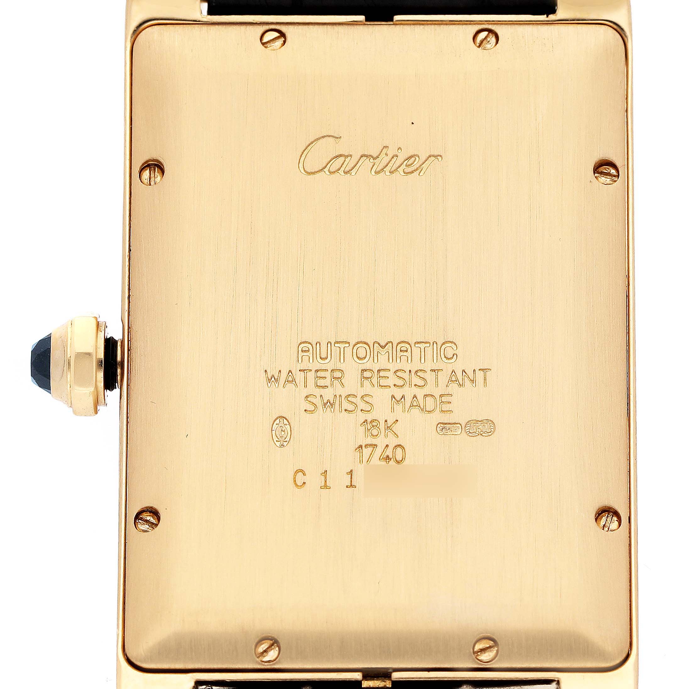 The image shows the back of a Cartier Tank Americaine W2603156 Men's Yellow Gold Silver Dial watch with details like "Automatic," "Water Resistant," and "18K" gold marking.