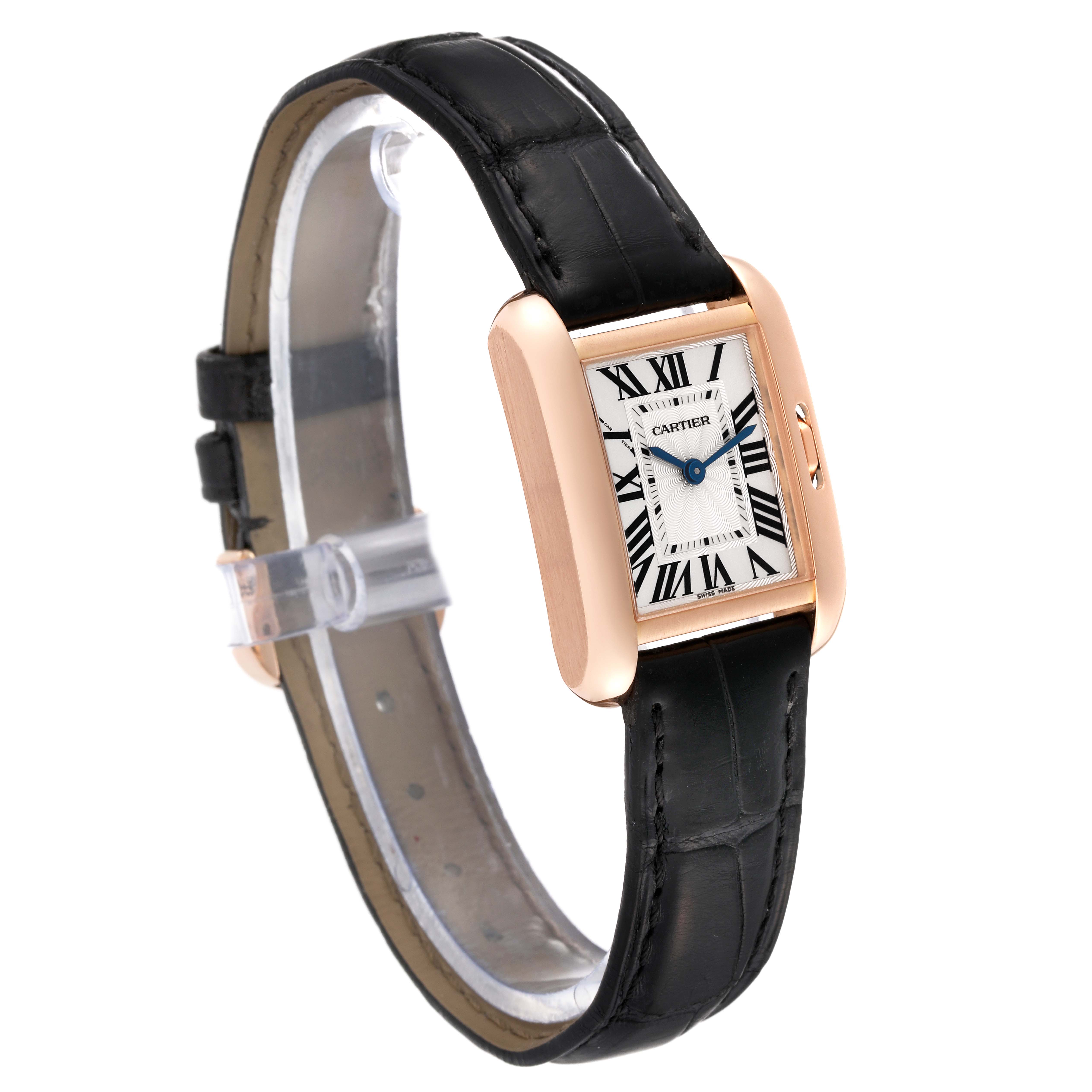 This Cartier Tank Anglaise W5310027 Women
s Rose Gold Silver Dial W5310027 Women
s Rose Gold Silver Dial watch is shown from an elevated side angle, displaying its rectangular face and black leather strap.